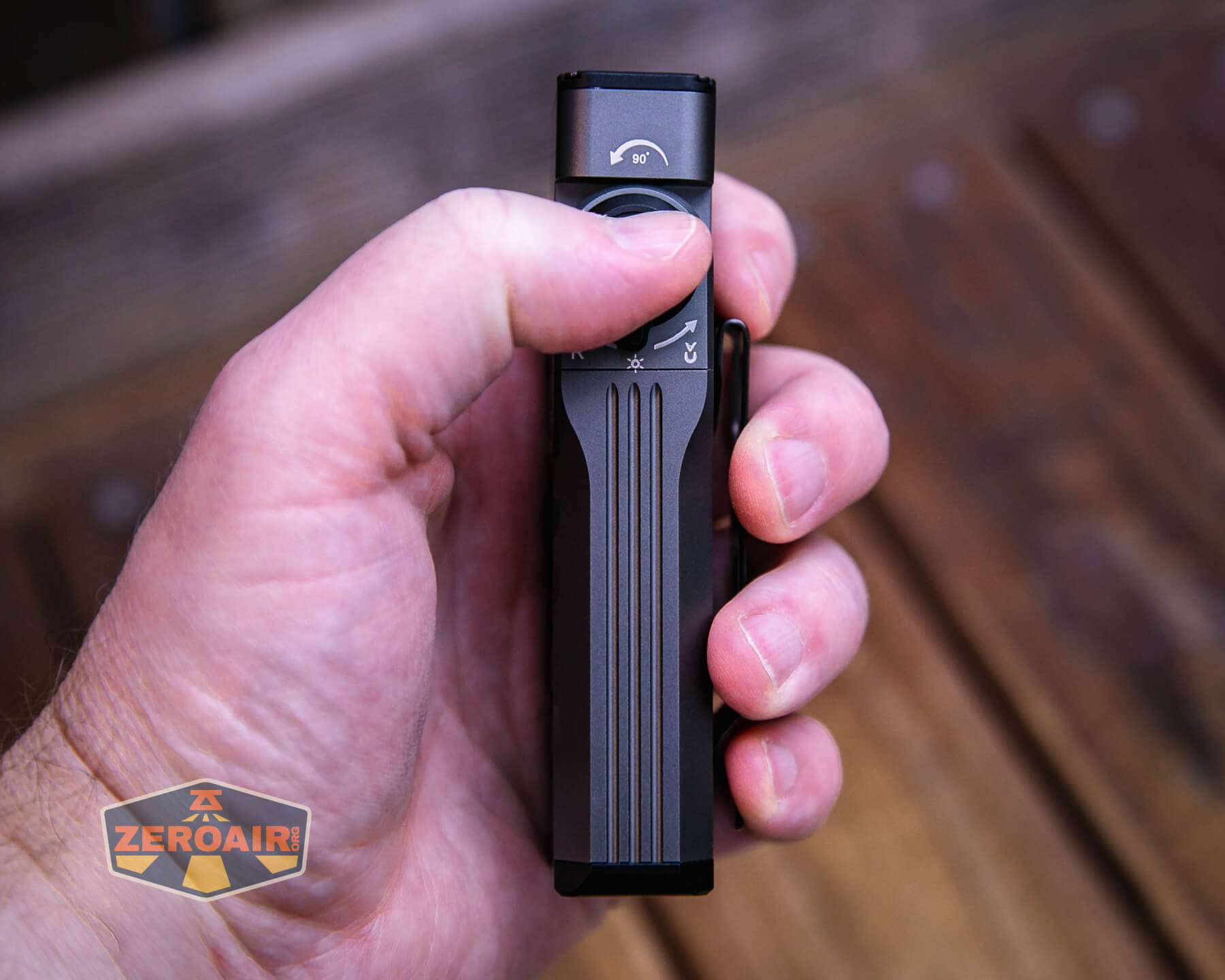 Sofirn ST2 multi-function flat flashlight in hand