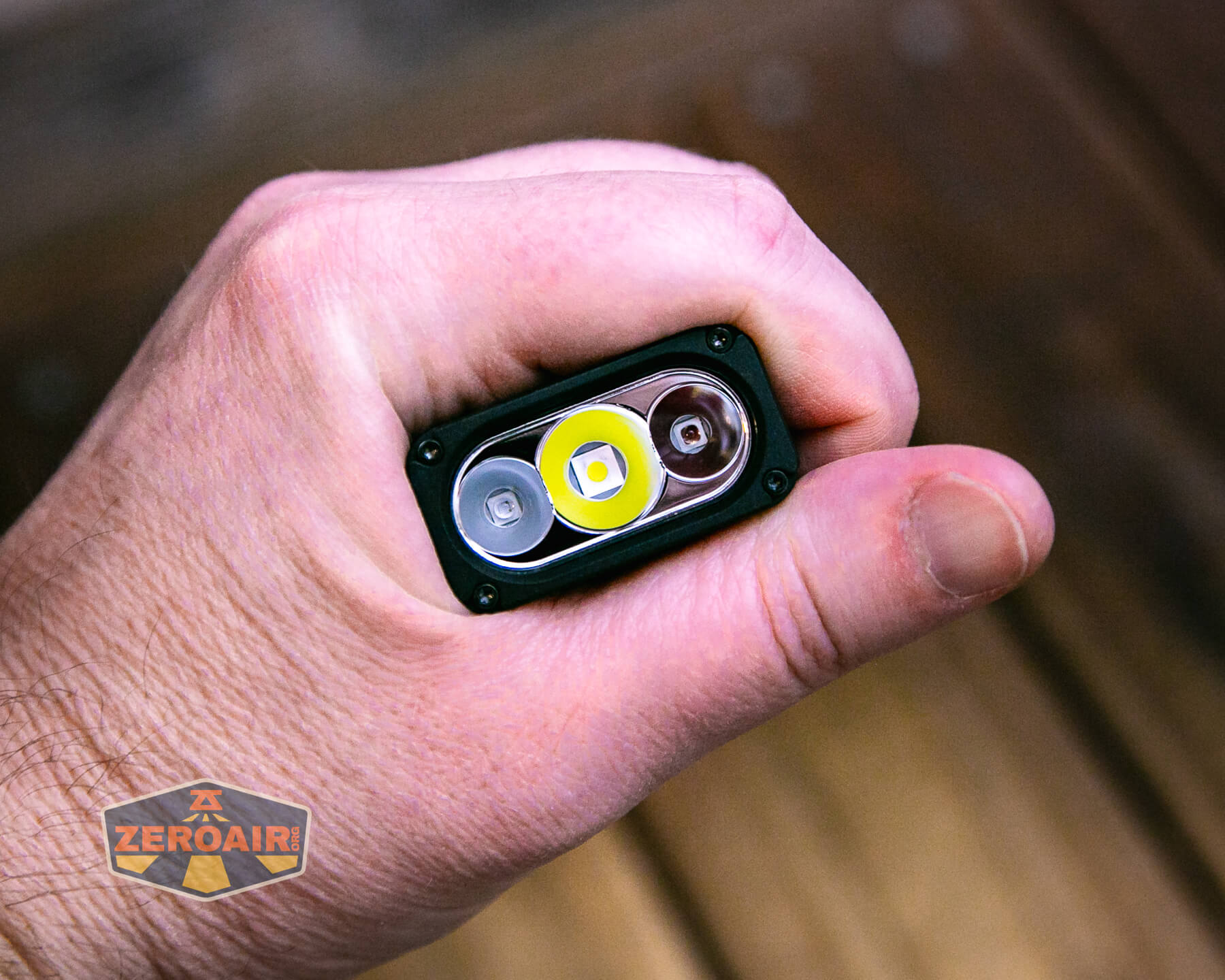 Sofirn ST2 multi-function flat flashlight in hand