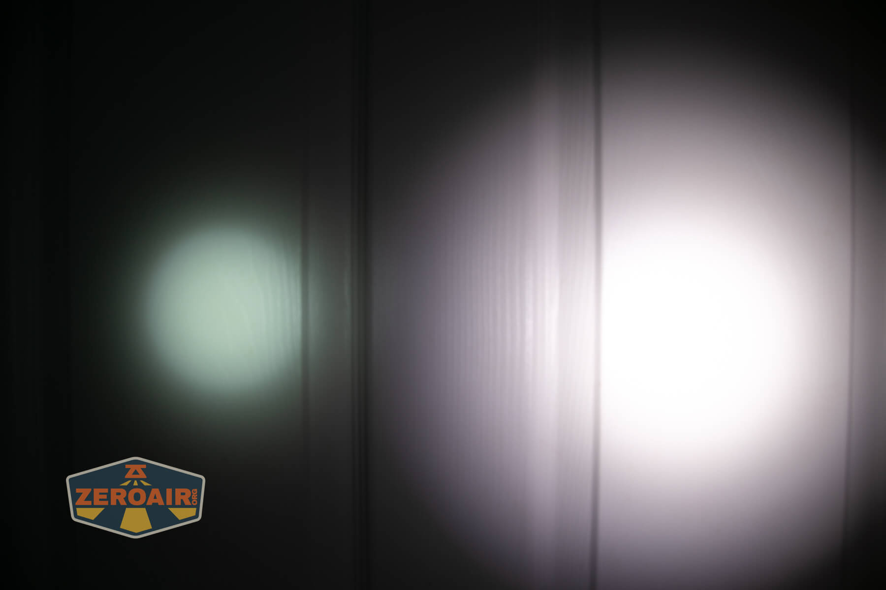 Sofirn ST2 multi-function flat flashlight beamshots on door (at 1') compared to nichia 219b 4500K
