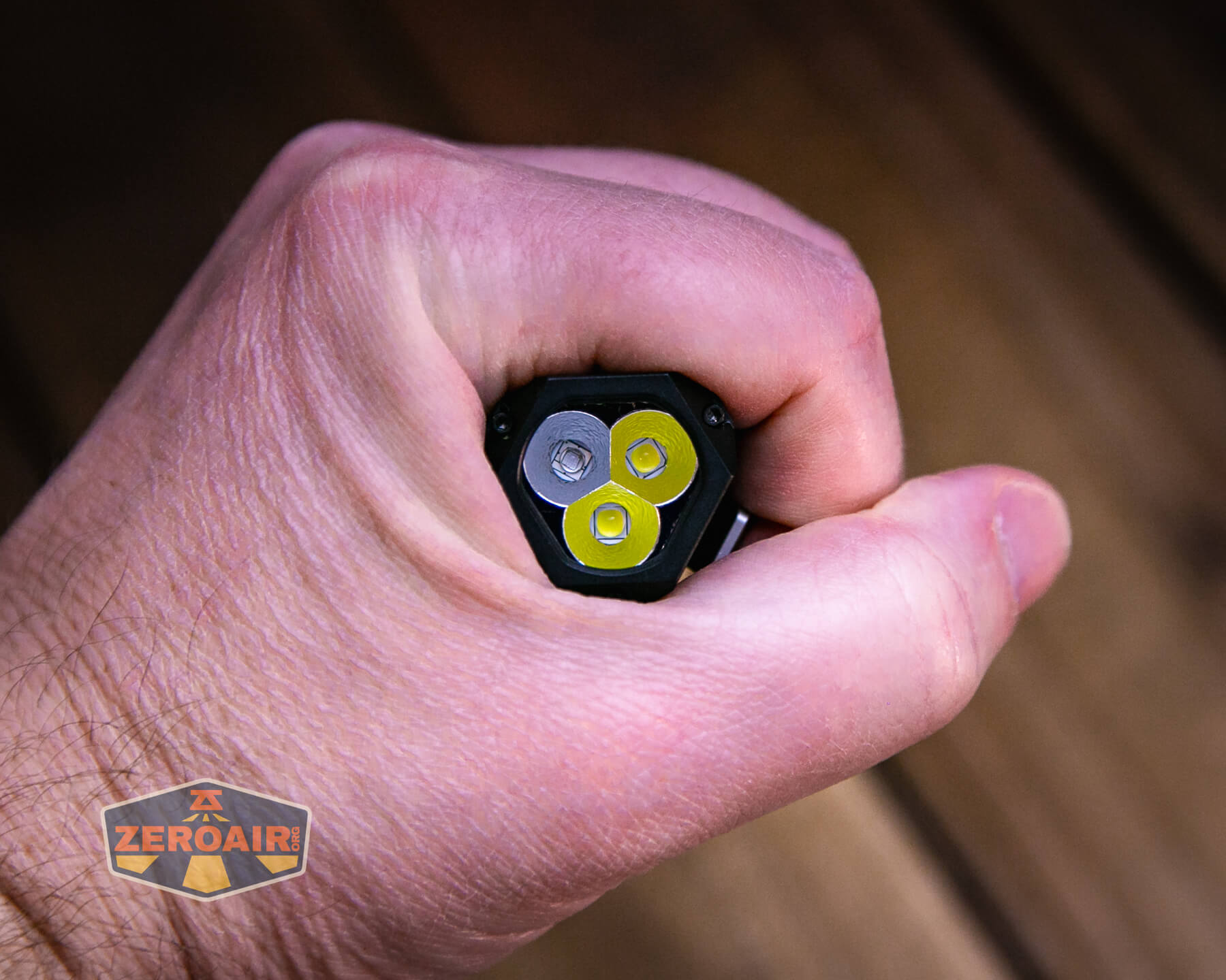 Wuben E Production flashlight in hand