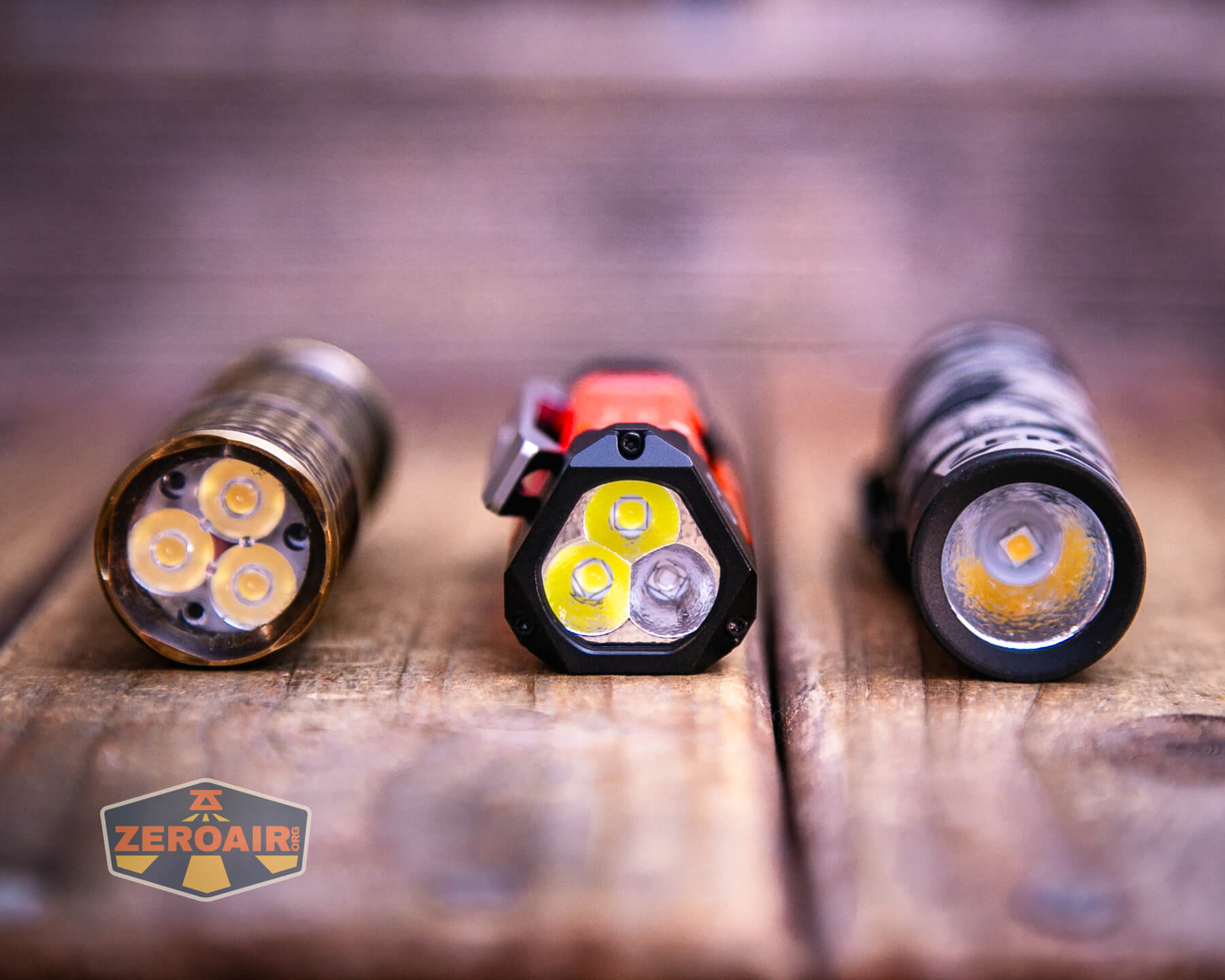 Wuben E8 production flashlight with two standard sized flashlights