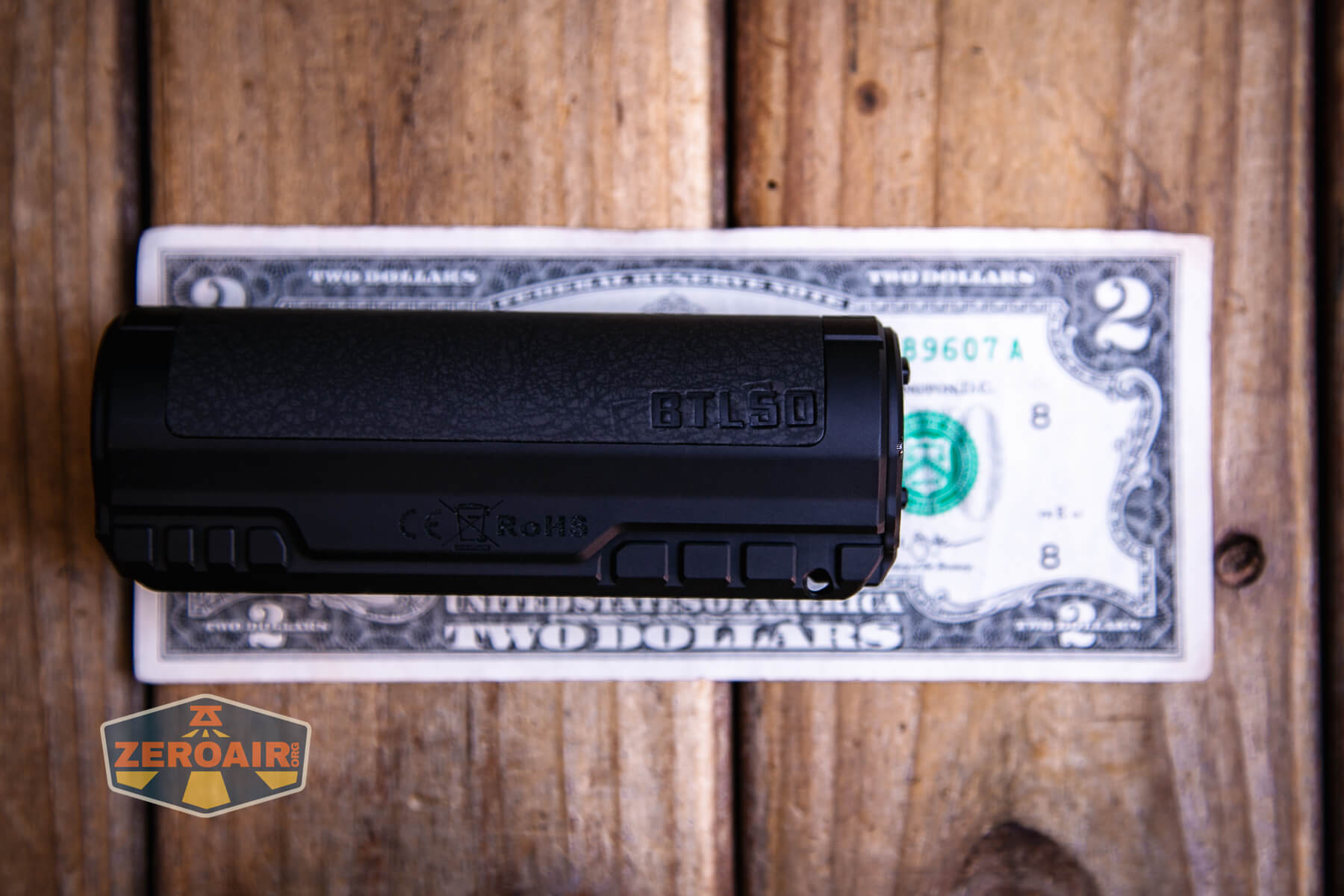 Imalent BTL50 black flashlight on a two dollar bill