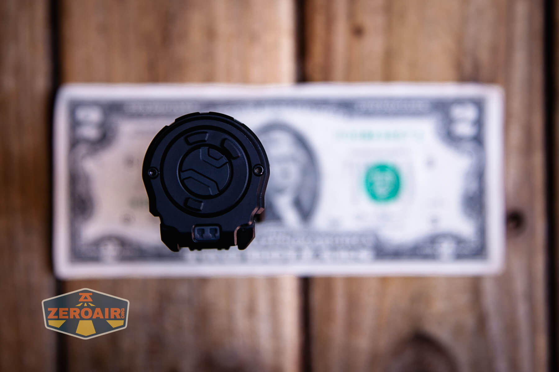 Imalent BTL50 black flashlight on a two dollar bill