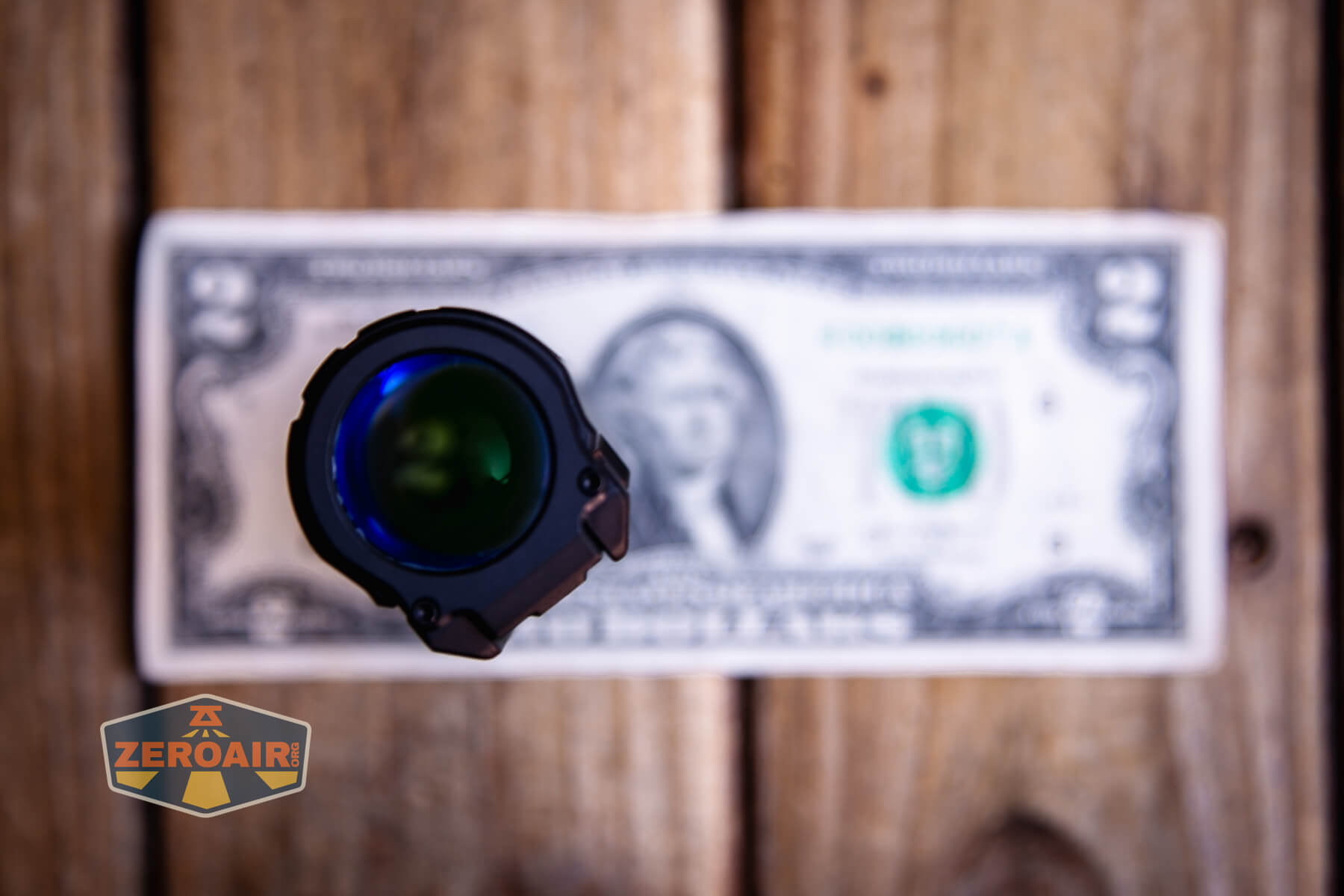 Imalent BTL50 black flashlight on a two dollar bill