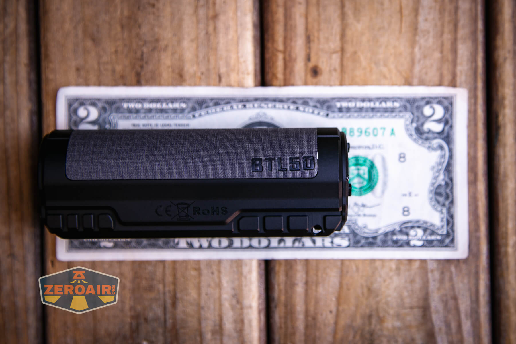 Imalent BTL50 Grey LEP flashlight on a two dollar bill