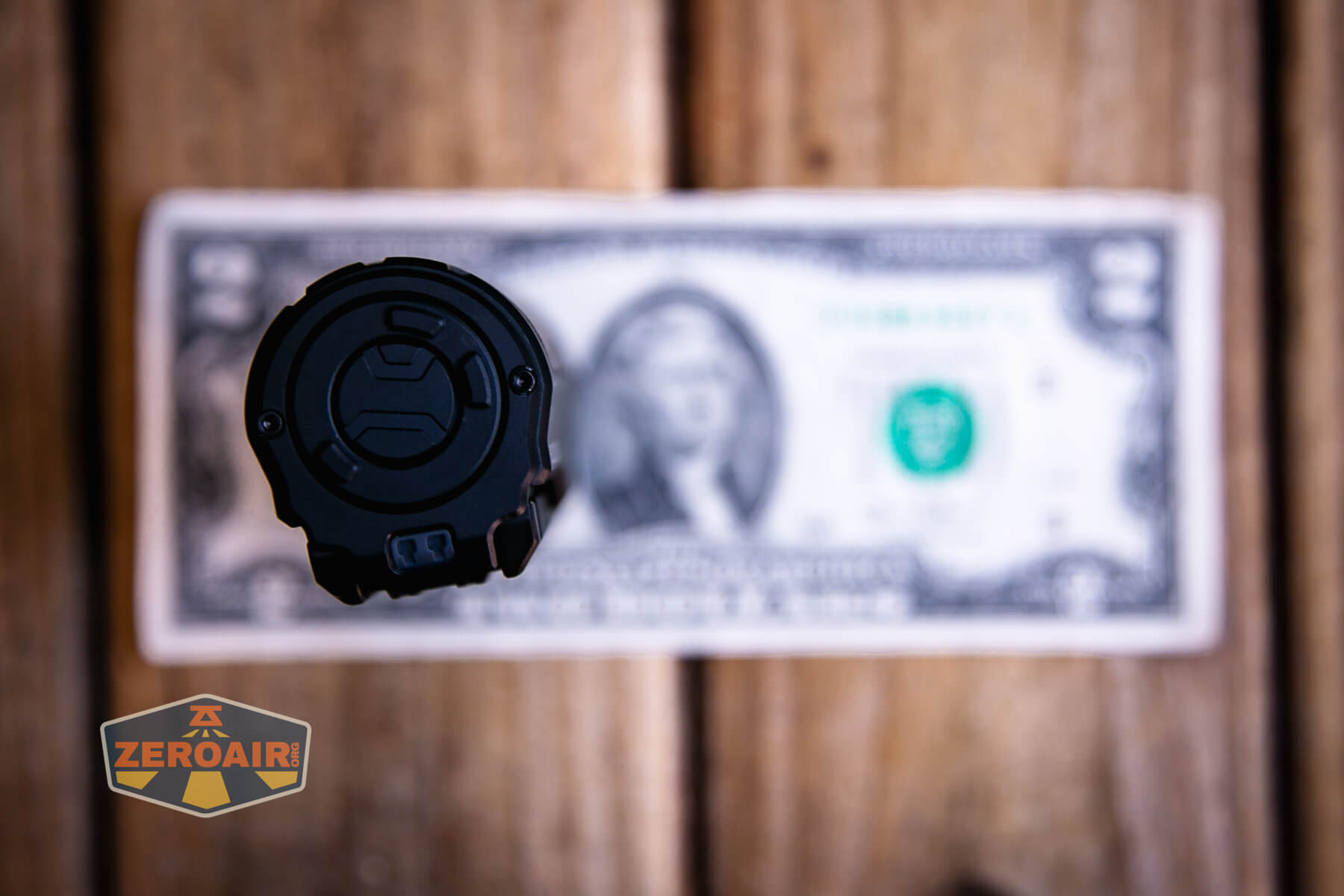Imalent BTL50 Grey LEP flashlight on a two dollar bill