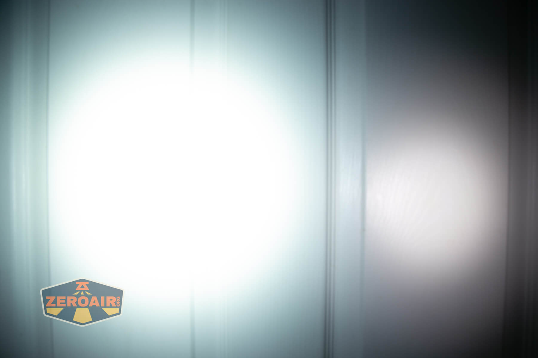 Imalent BTL50 Grey LEP flashlight beamshots on door (at 1') compared to nichia 219b 4500K