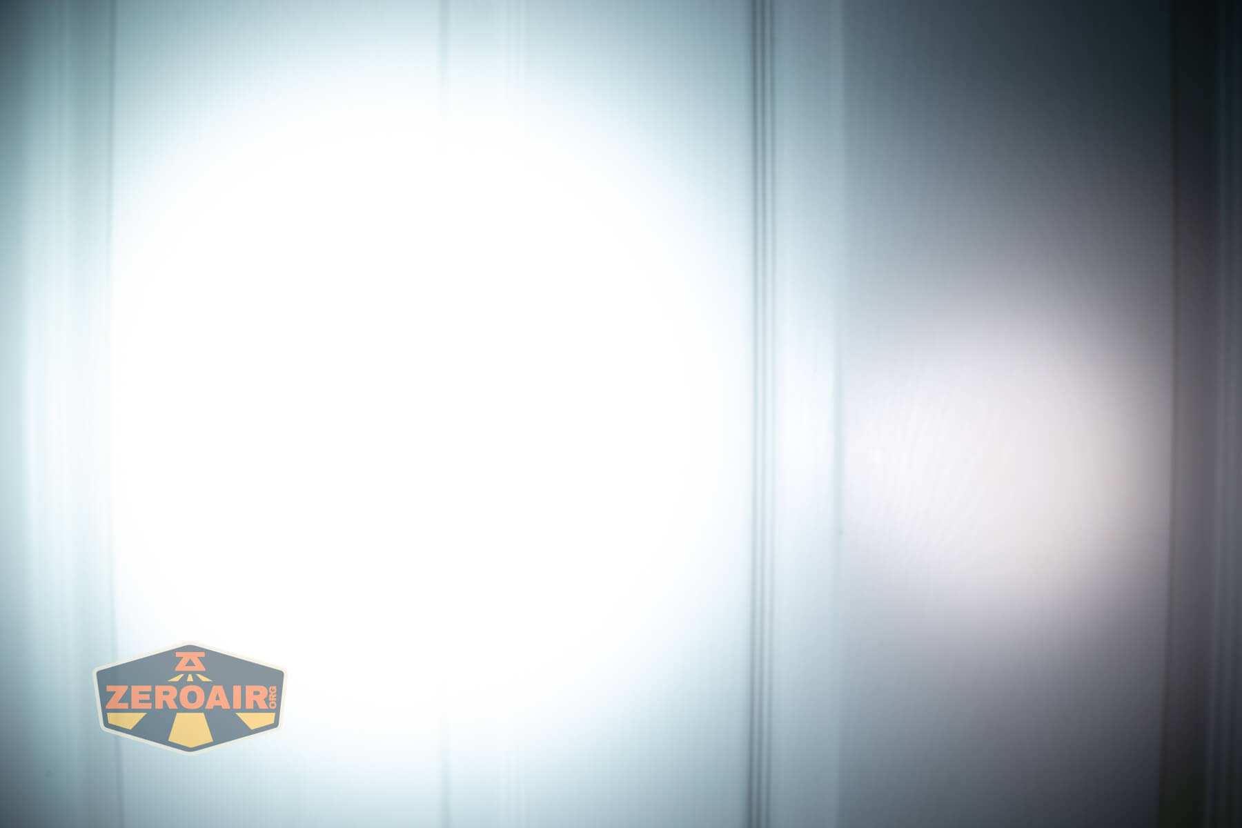 Imalent BTL50 Grey LEP flashlight beamshots on door (at 1') compared to nichia 219b 4500K