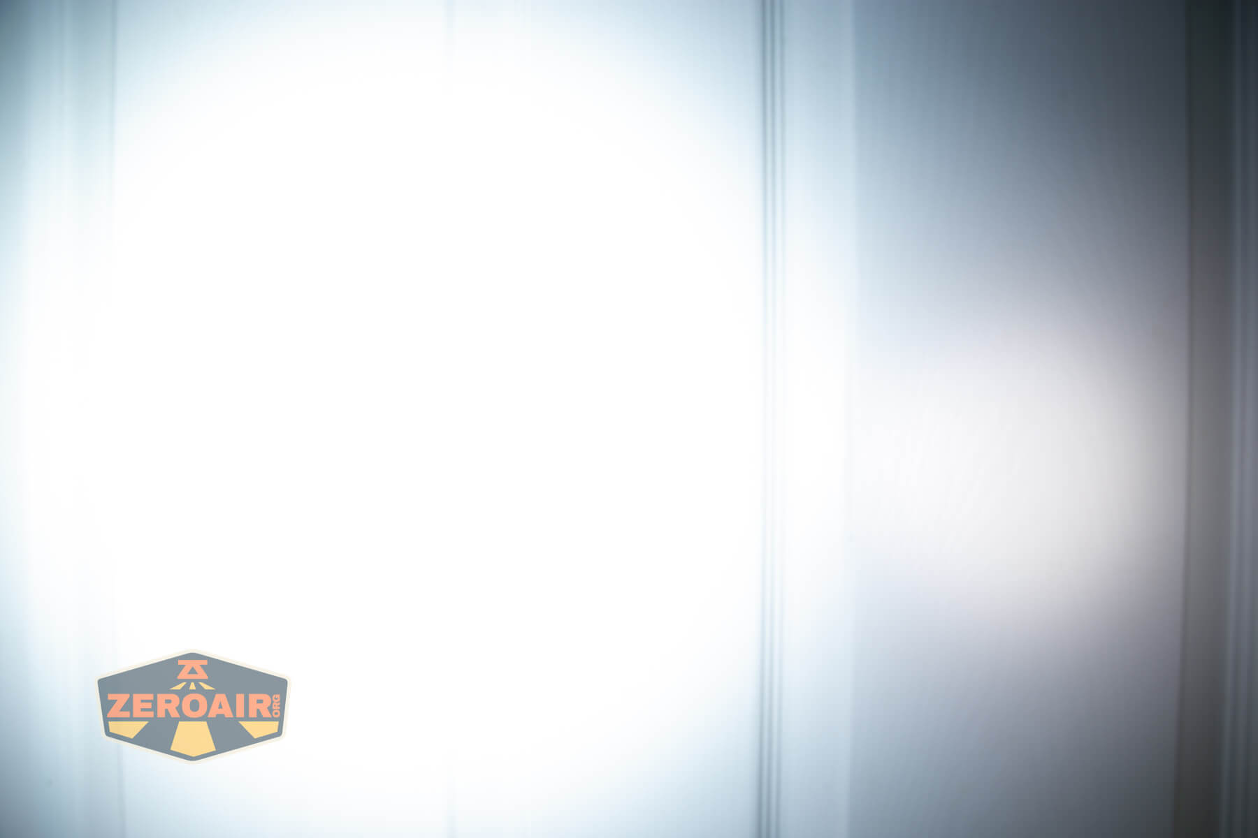 Imalent BTL50 Grey LEP flashlight beamshots on door (at 1') compared to nichia 219b 4500K