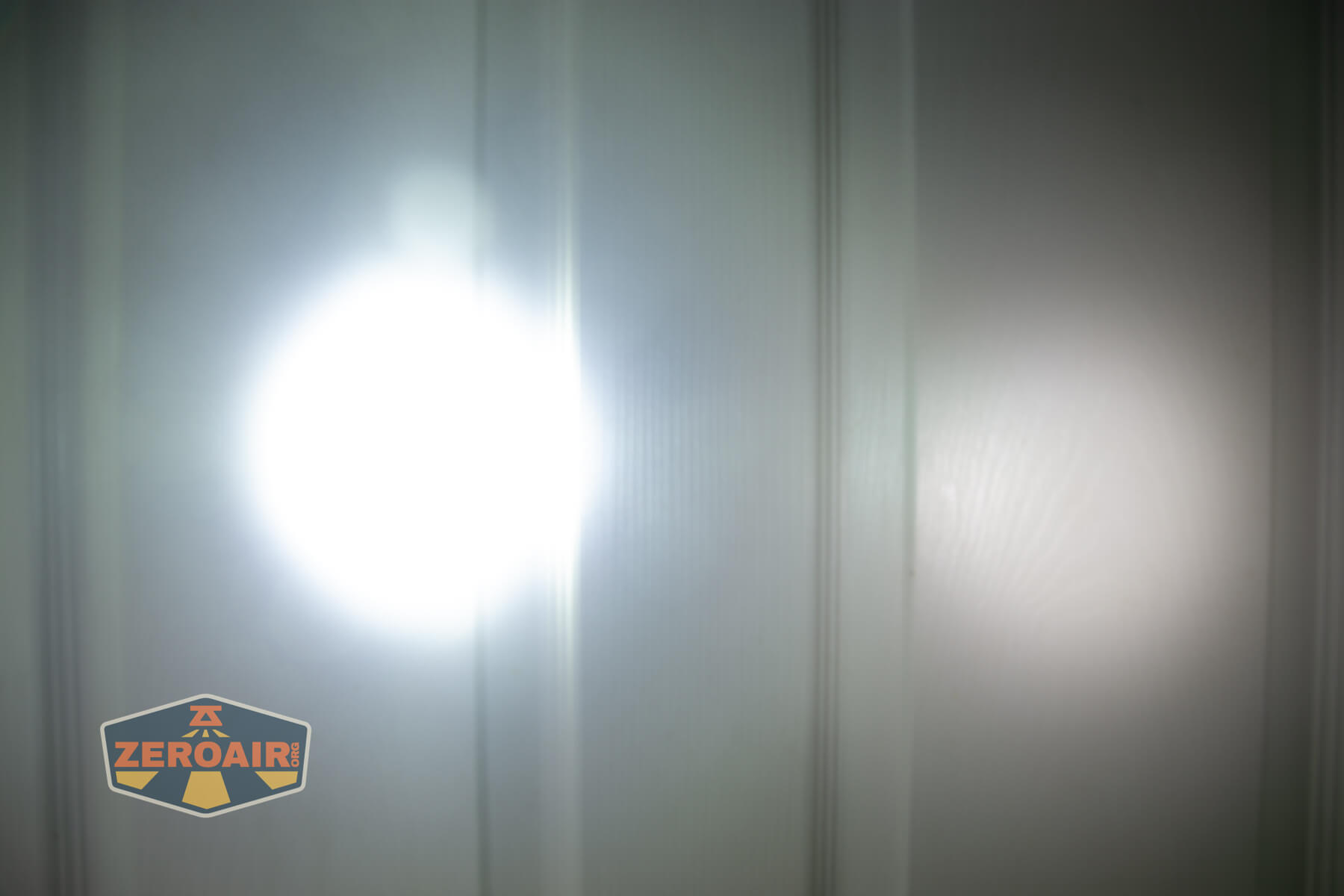 Imalent BTL50 Grey LEP flashlight beamshots on door (at 1') compared to nichia 219b 4500K