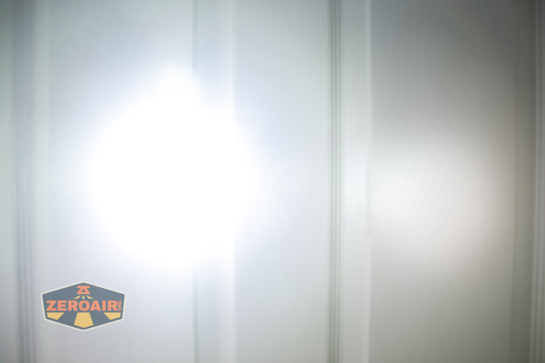 Imalent BTL50 Grey LEP flashlight beamshots on door (at 1') compared to nichia 219b 4500K