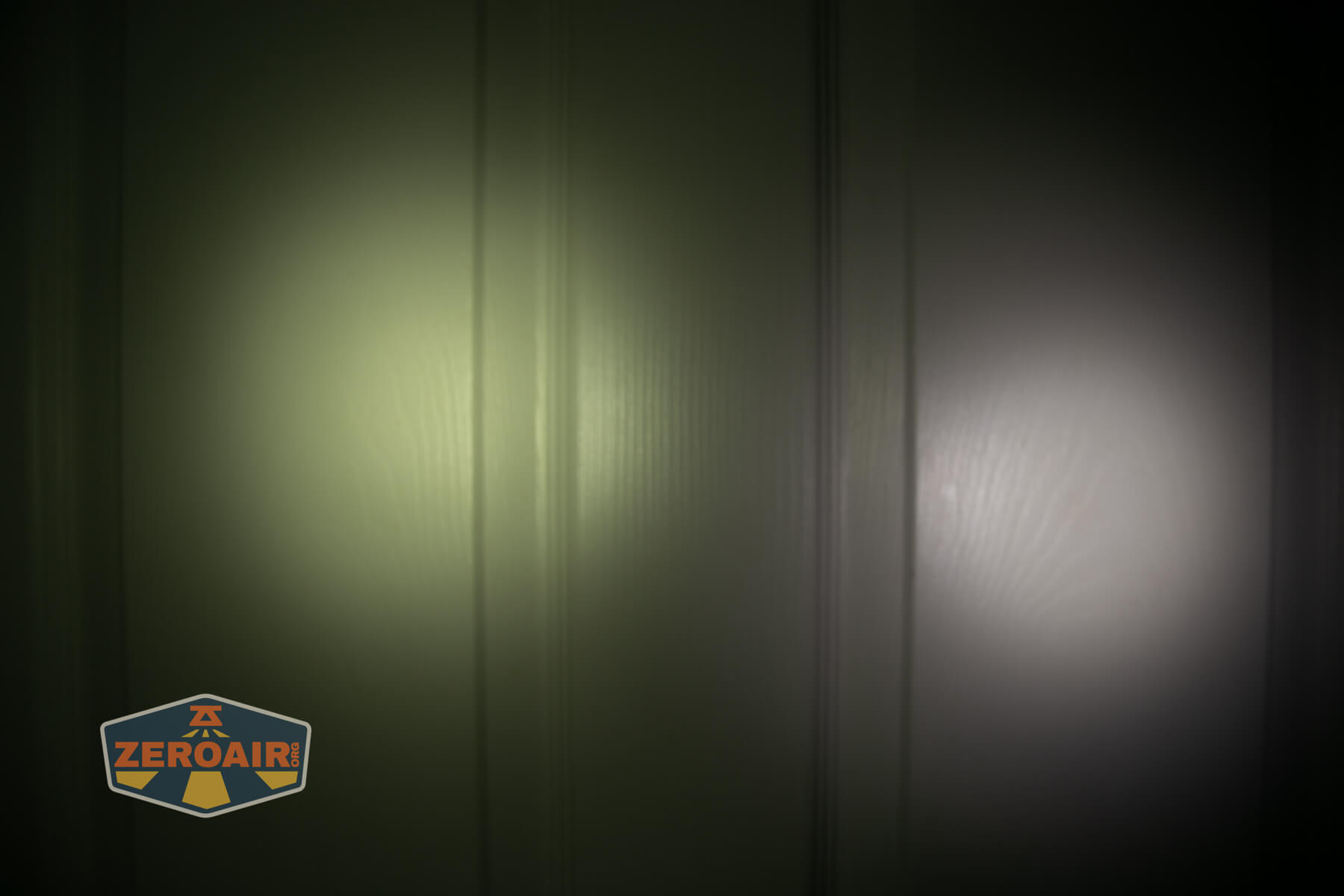 JETBeam E28 EDC Multi-mode Flat Tactical flashlight beamshots on door (at 1') compared to nichia 219b 4500K