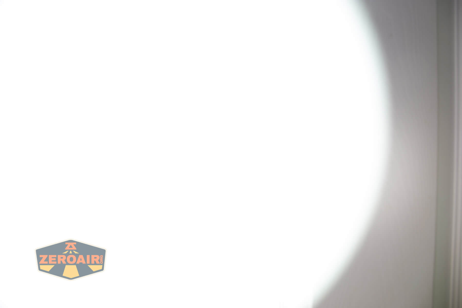 JETBeam E28 EDC Multi-mode Flat Tactical flashlight beamshots on door (at 1') compared to nichia 219b 4500K