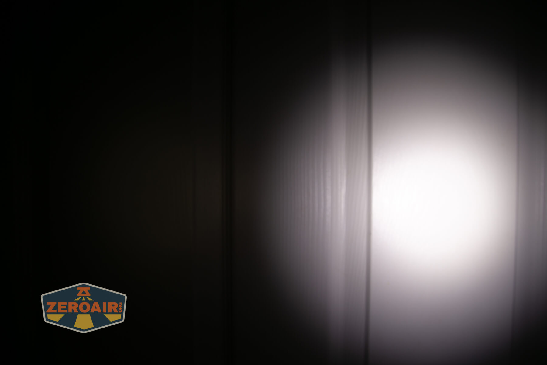 ReyLight Penlight MkII Aluminum beamshots on door (at 1') compared to nichia 219b 4500K