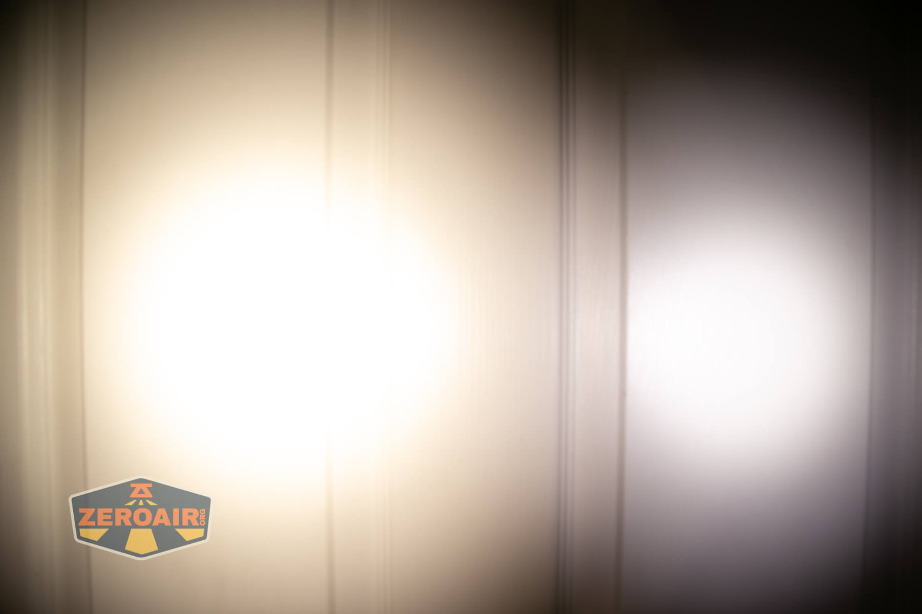 ReyLight Penlight MkII Aluminum beamshots on door (at 1') compared to nichia 219b 4500K