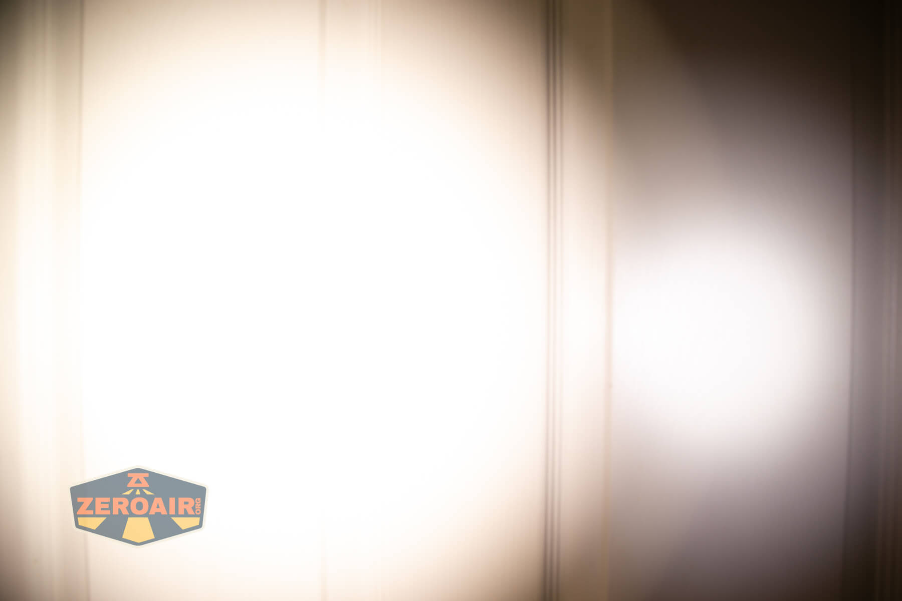 ReyLight Penlight MkII Aluminum beamshots on door (at 1') compared to nichia 219b 4500K