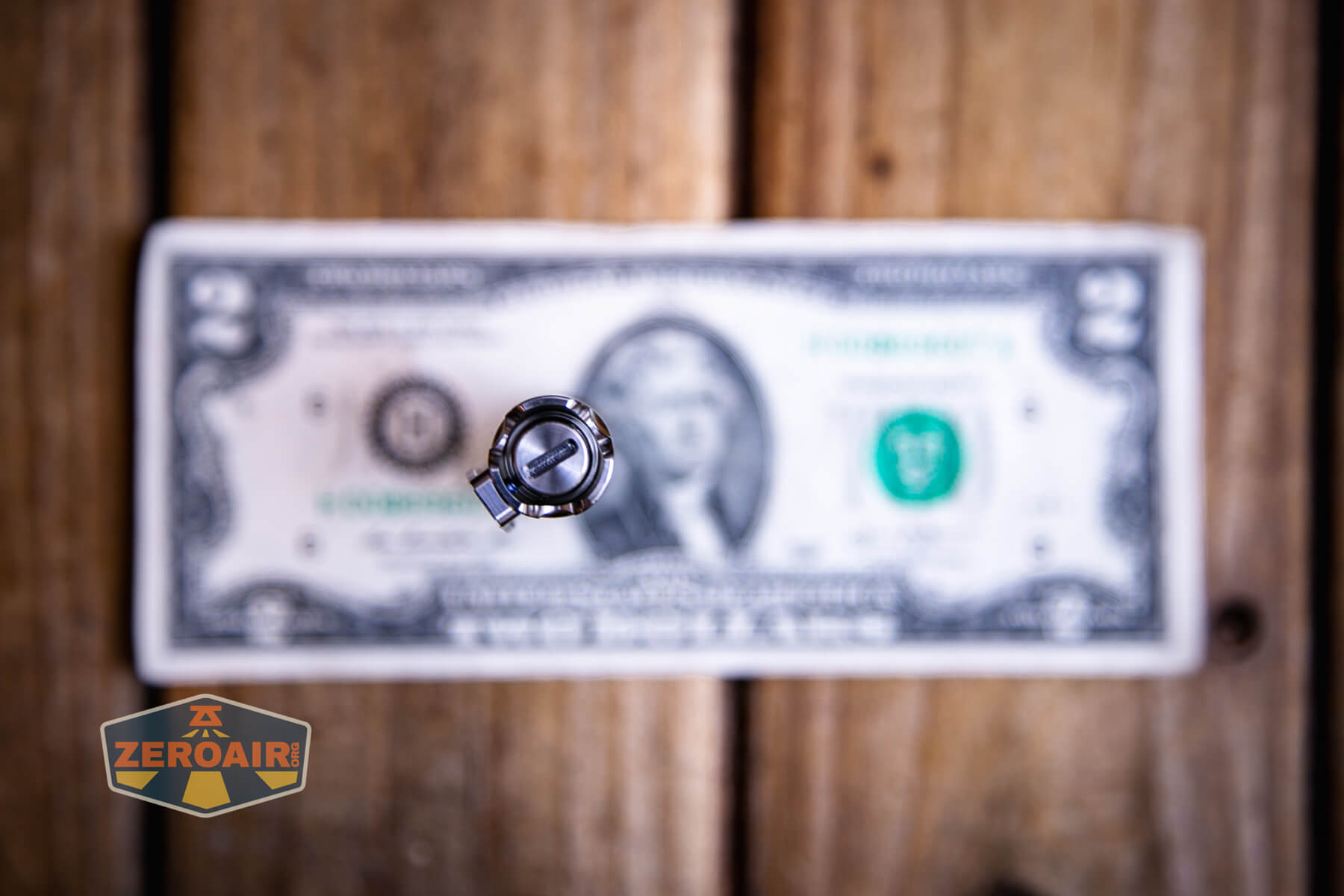 Reylight Pineapple Mini Mk3 Krystal on a two dollar bill