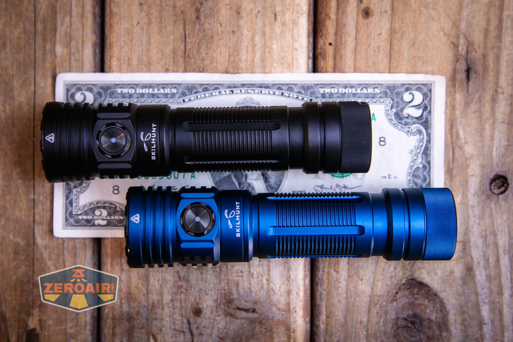Skilhunt M300 V4 blue flashlight on a two dollar bill