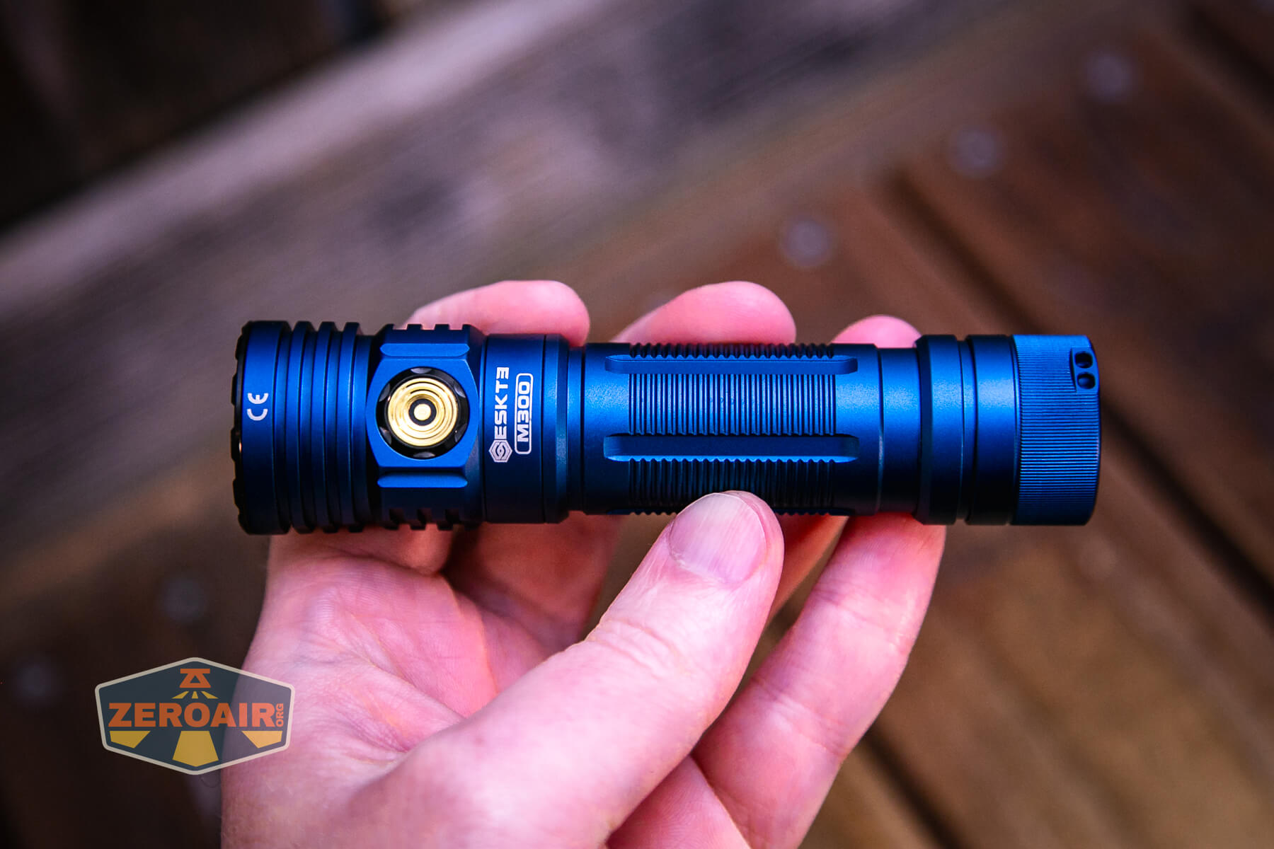 Skilhunt M300 V4 blue flashlight in hand
