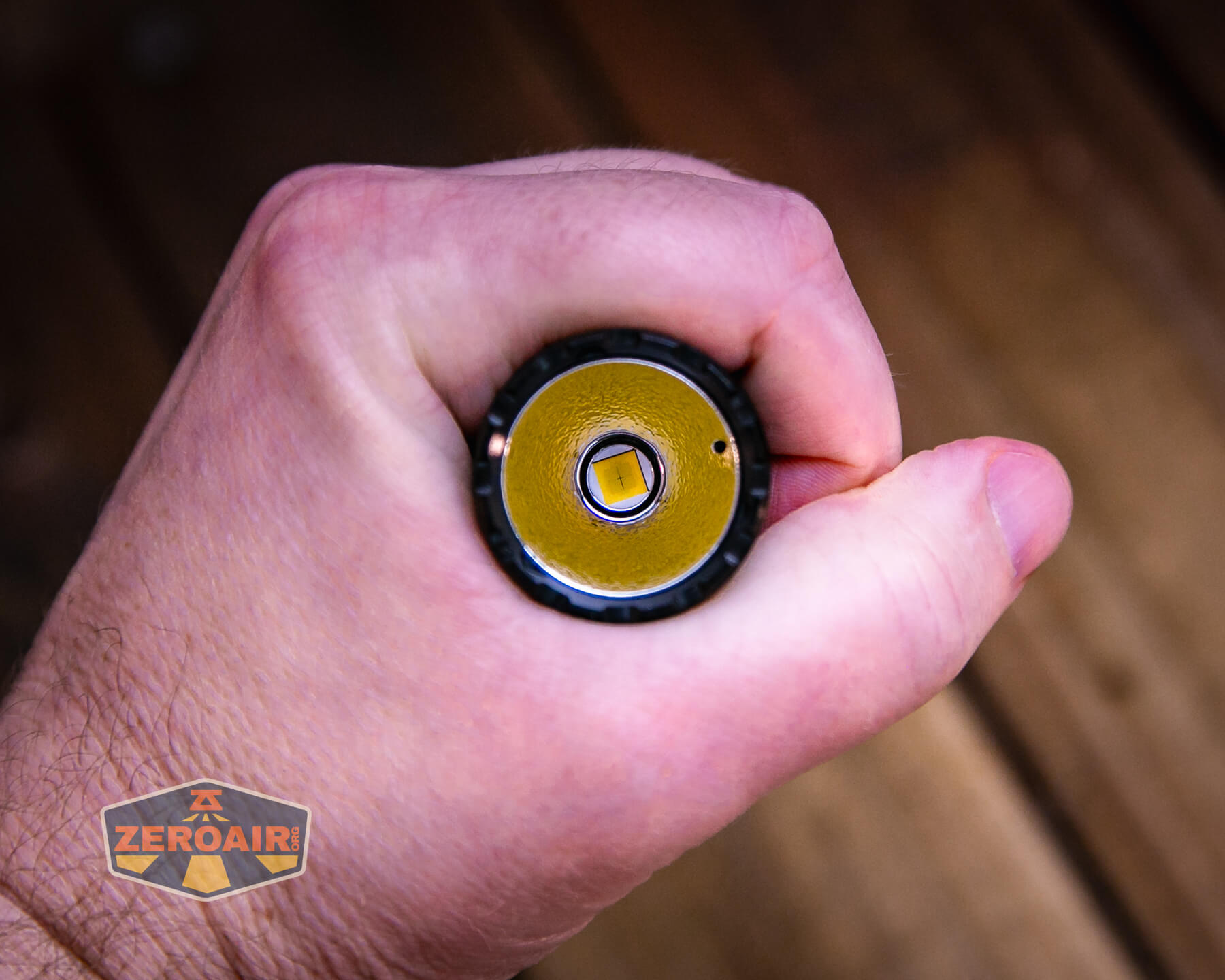 Skilhunt M300 V4 blue flashlight in hand