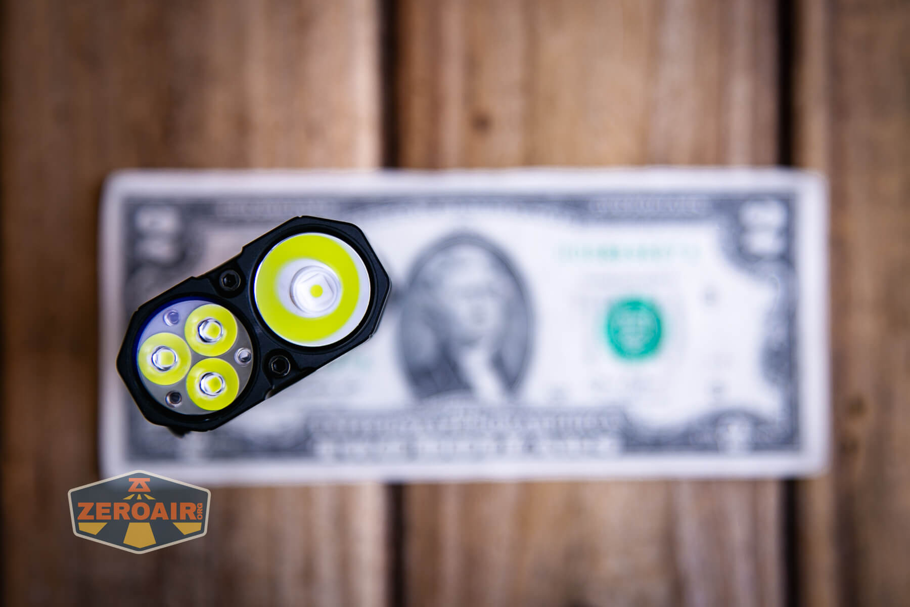 LoopGear SK-05 II Pro flashlight on a two dollar bill