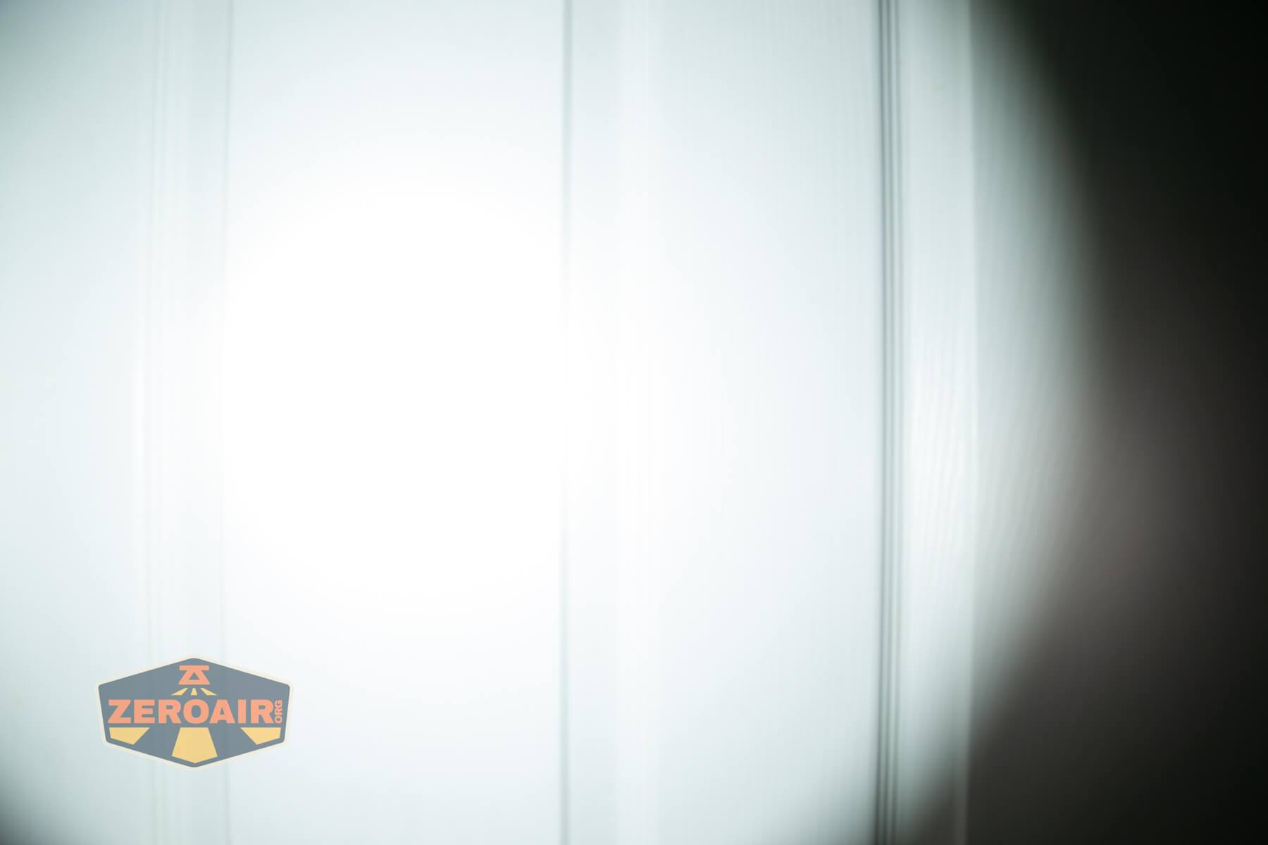 LoopGear SK-05 II Pro flashlight beamshots on door (at 1') compared to nichia 219b 4500K