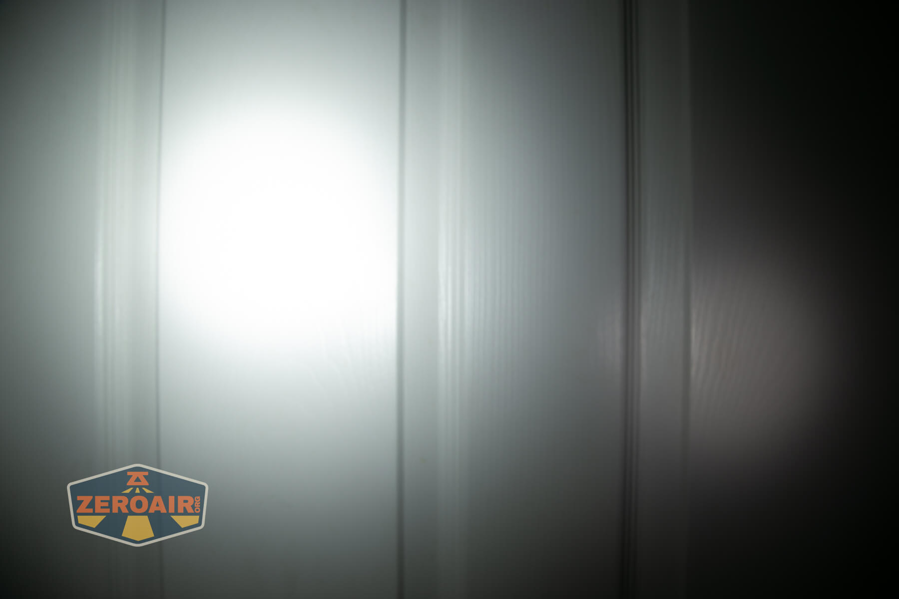 LoopGear SK-05 II Pro flashlight beamshots on door (at 1') compared to nichia 219b 4500K