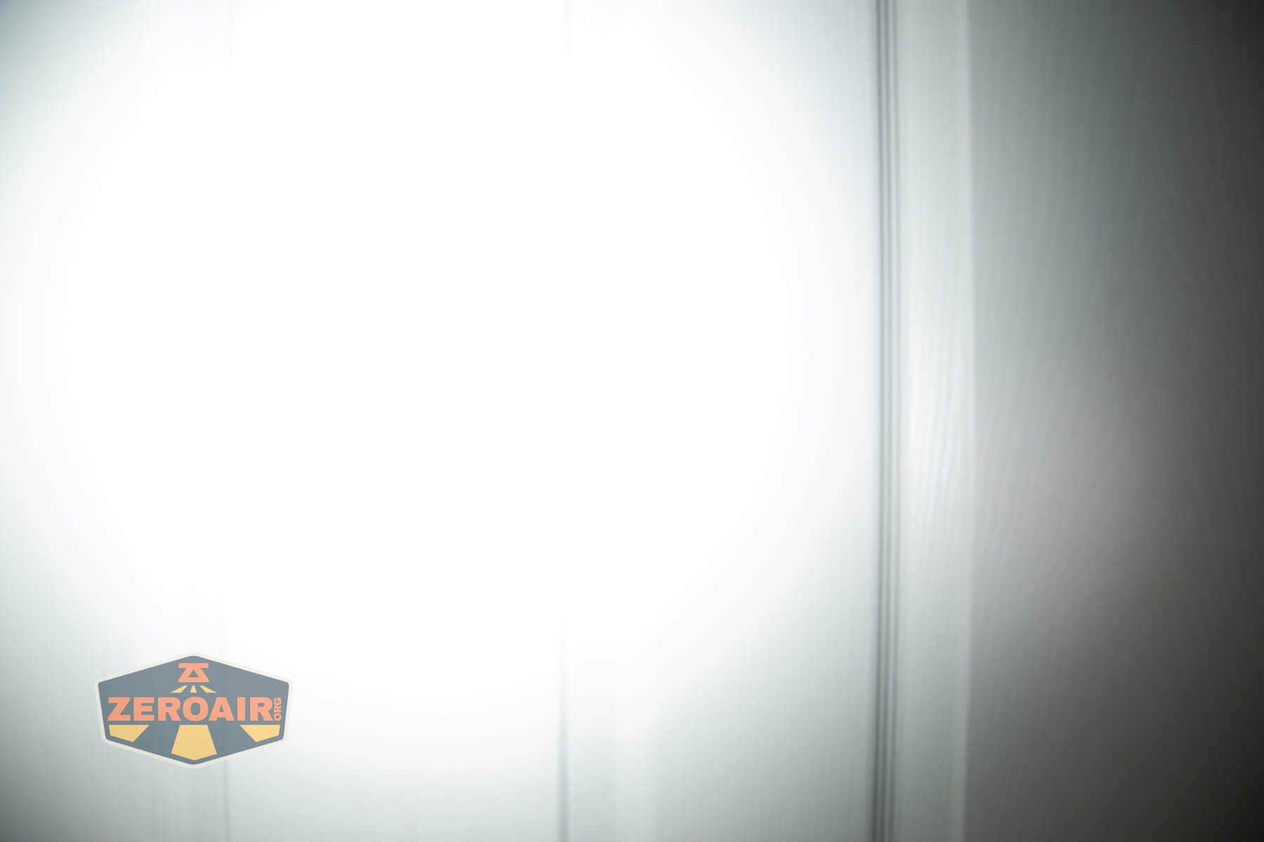 LoopGear SK-05 II Pro flashlight beamshots on door (at 1') compared to nichia 219b 4500K