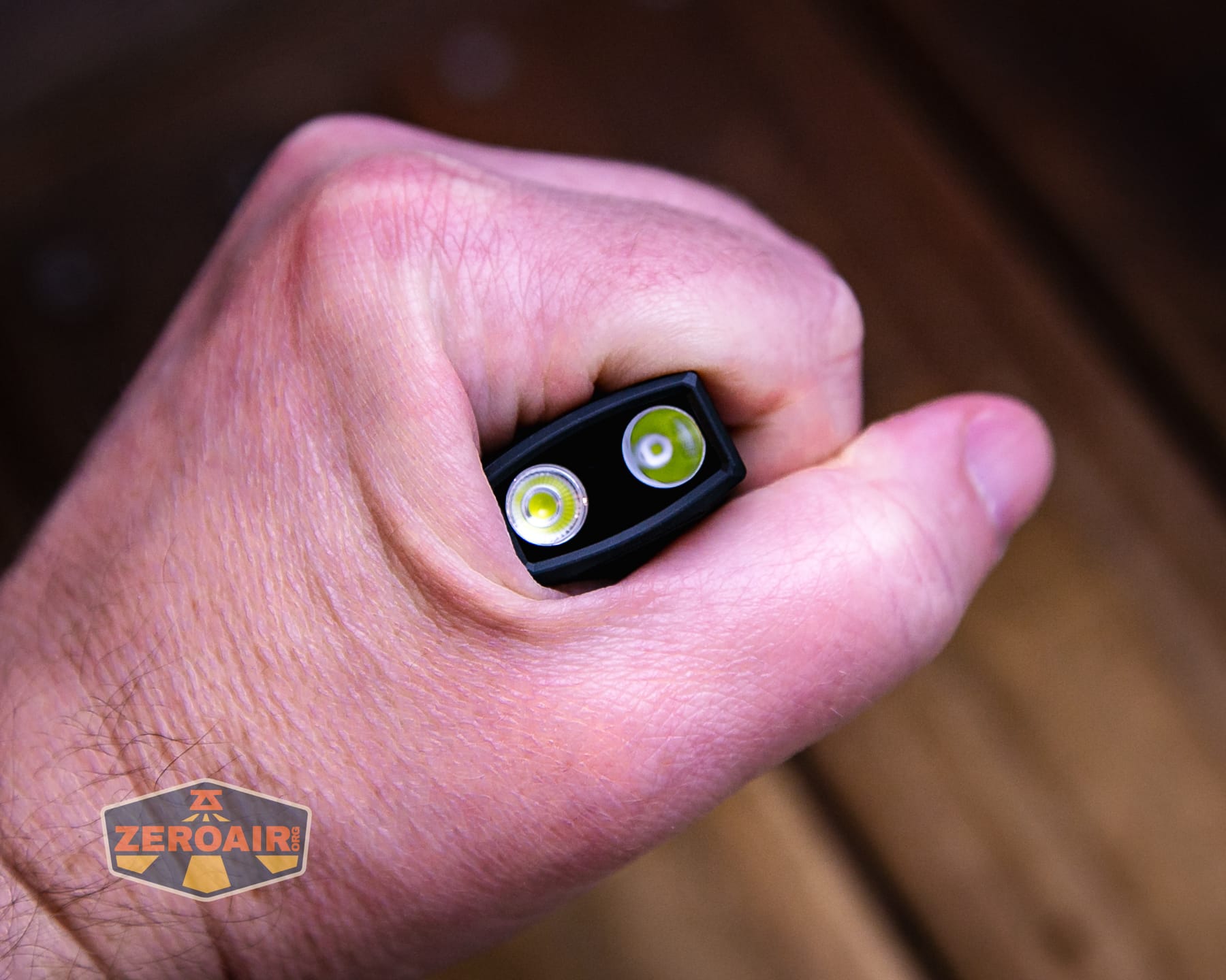 Olight ArkPro Ultra Onyx Black flashlight in hand