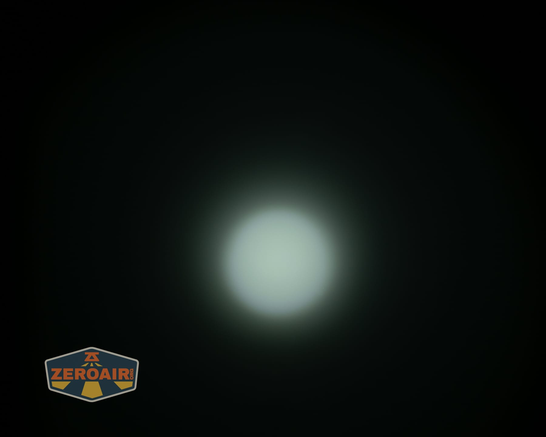 Olight ArkPro Ultra Onyx Black flashlight beamshots on ceiling