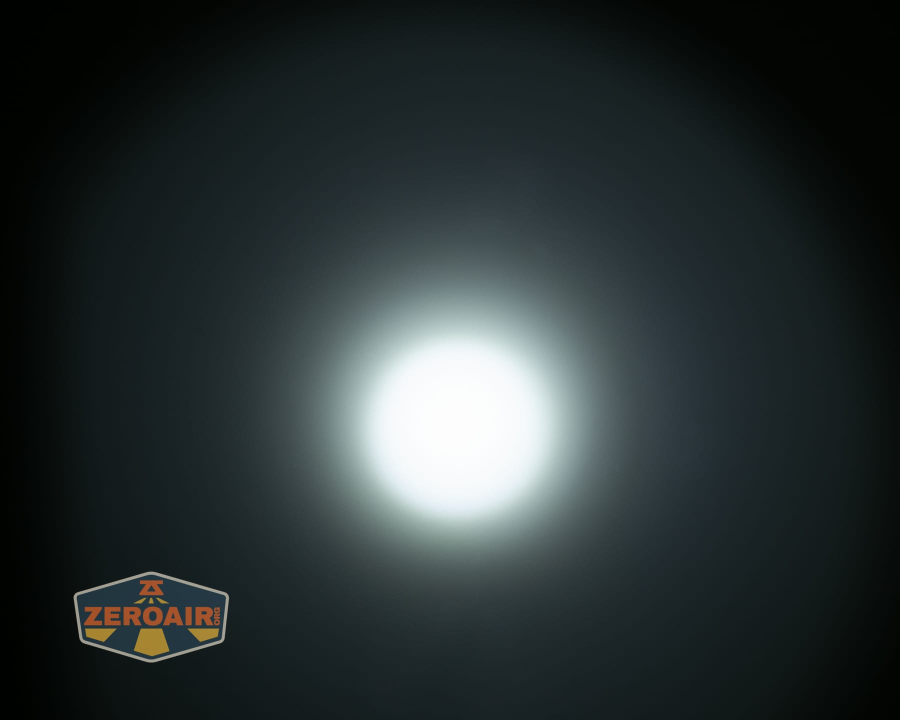 Olight ArkPro Ultra Onyx Black flashlight beamshots on ceiling