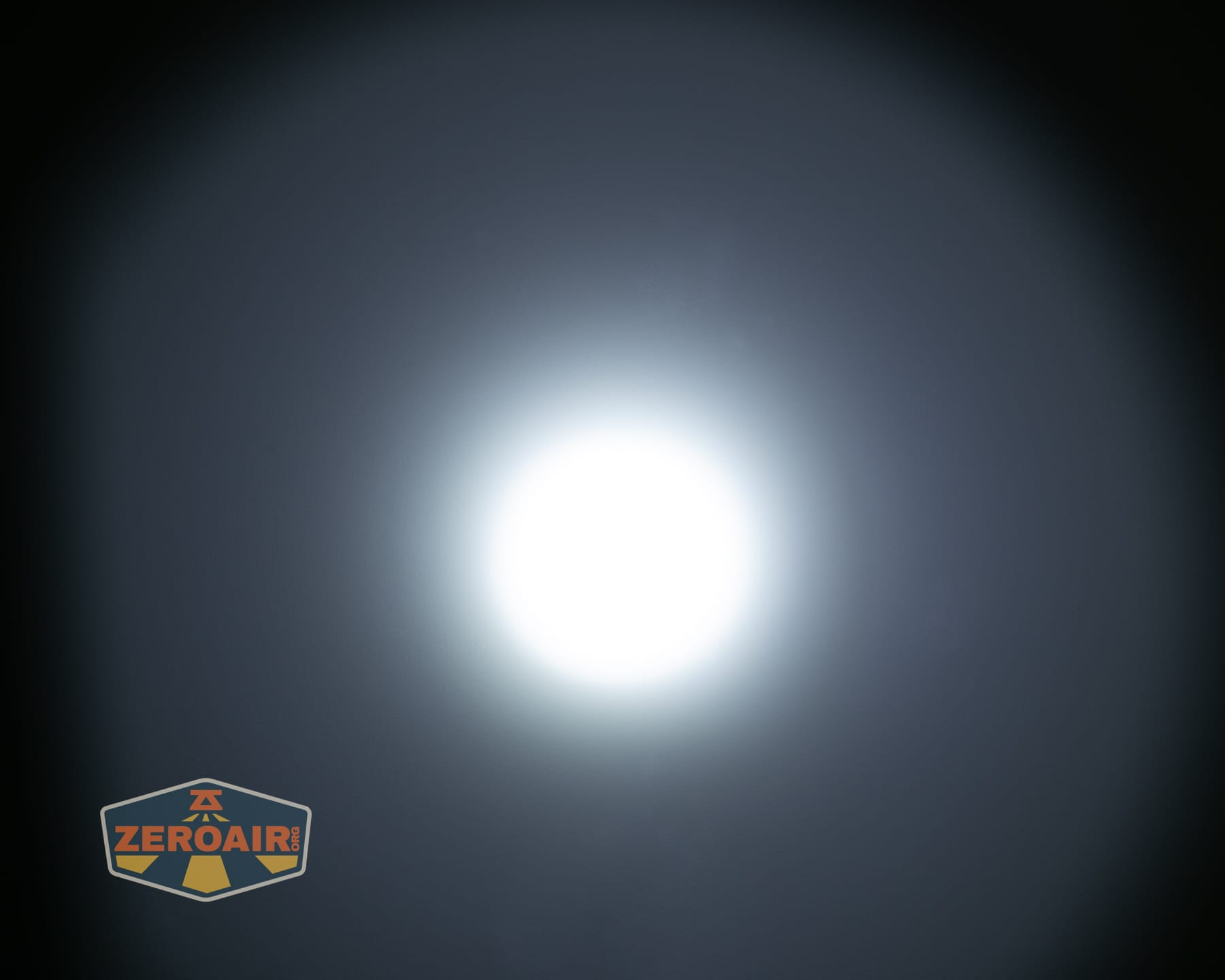 Olight ArkPro Ultra Onyx Black flashlight beamshots on ceiling