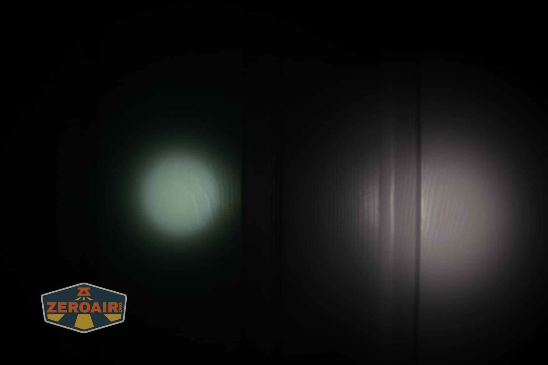 Olight ArkPro Ultra Onyx Black flashlight beamshots on door (at 1') compared to nichia 219b 4500K