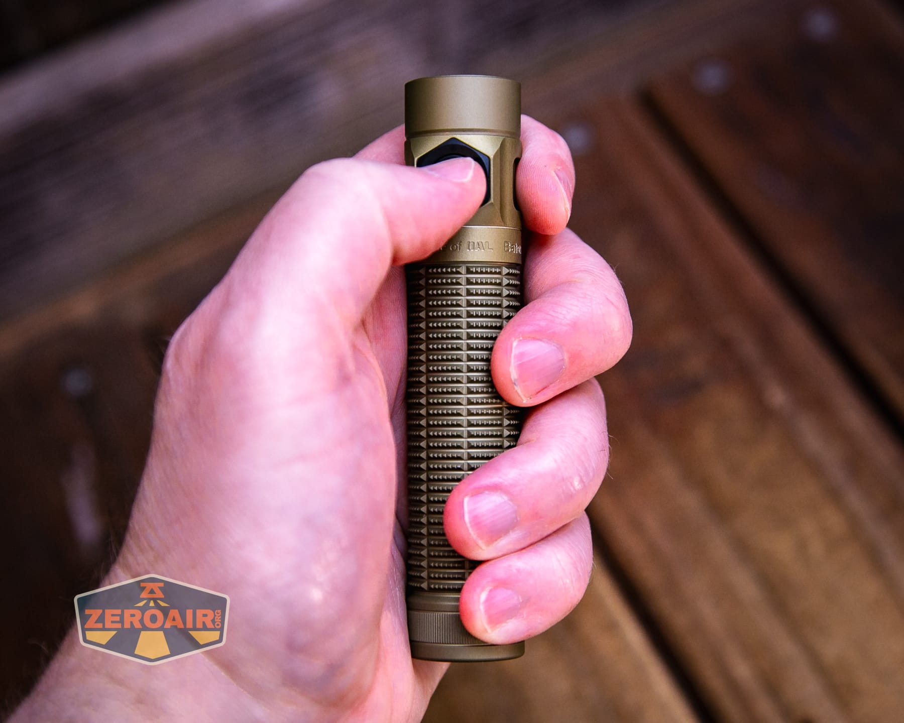 Olight Baton Ultra OAL flashlight in hand