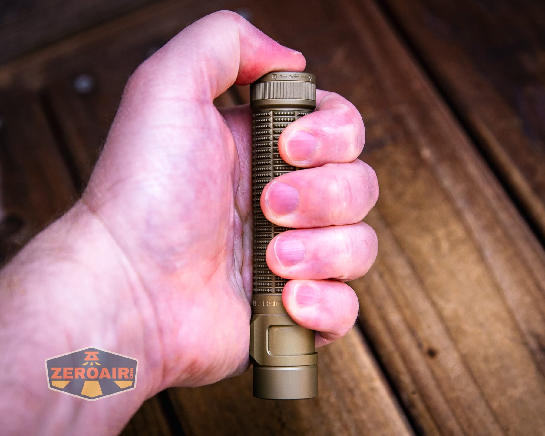 Olight Baton Ultra OAL flashlight in hand