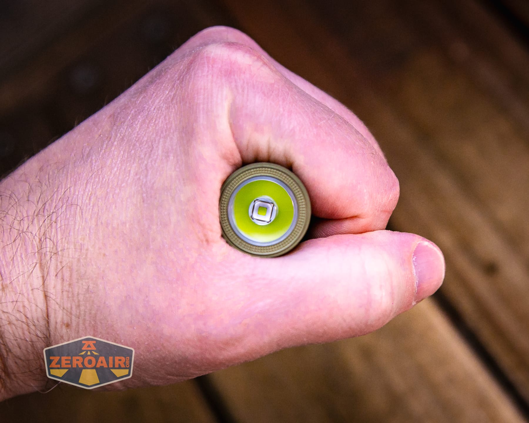 Olight Baton Ultra OAL flashlight in hand