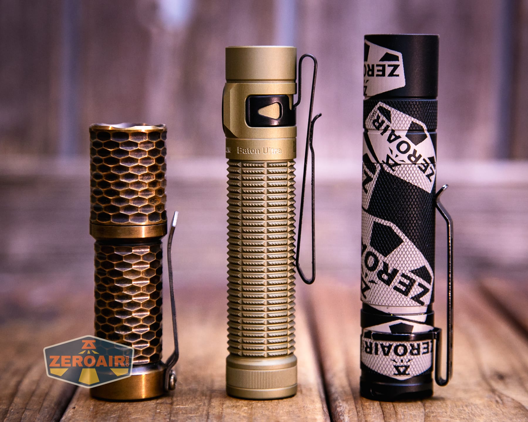 Olight Baton Ultra OAL flashlight with two standard sized flashlights