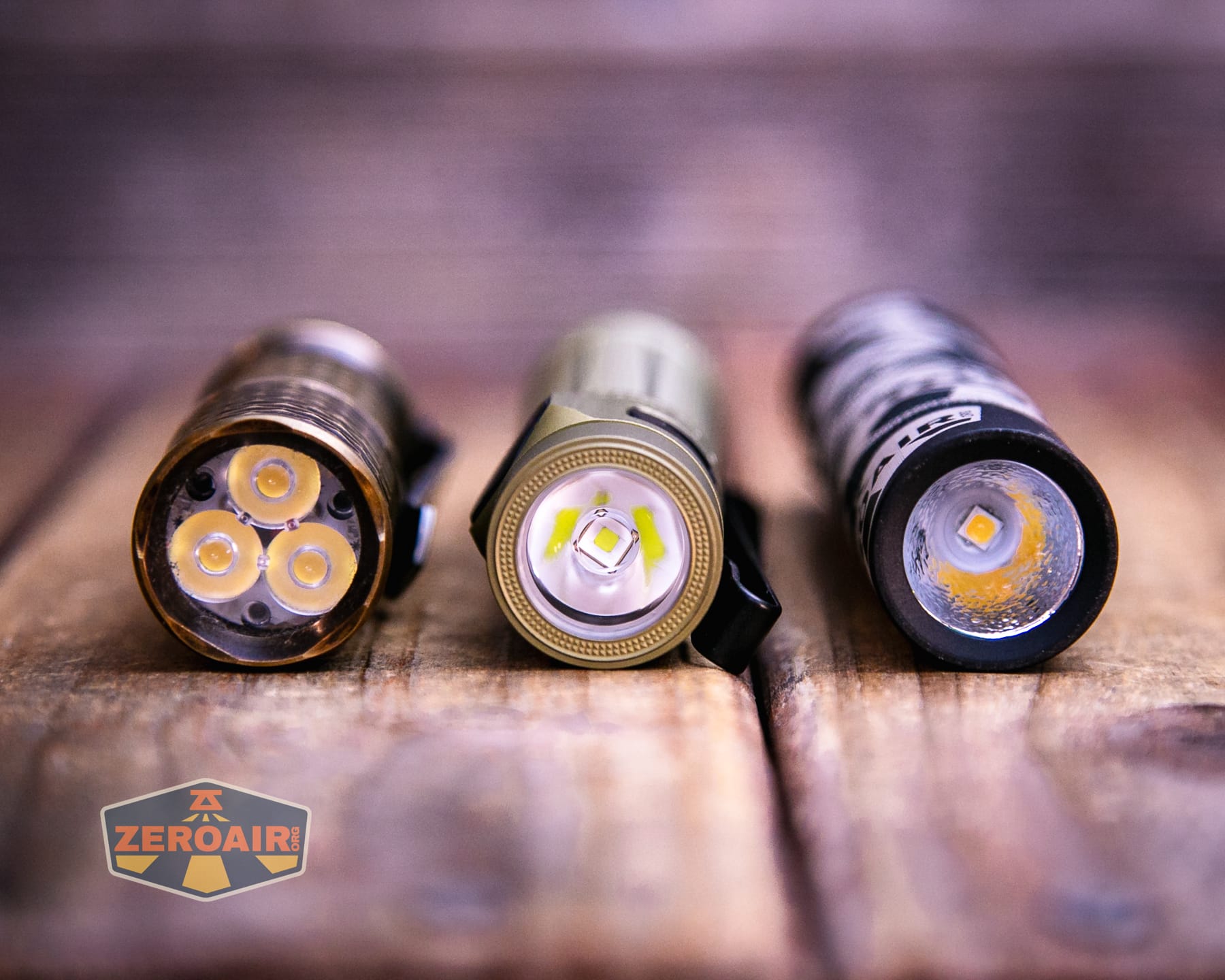 Olight Baton Ultra OAL flashlight with two standard sized flashlights