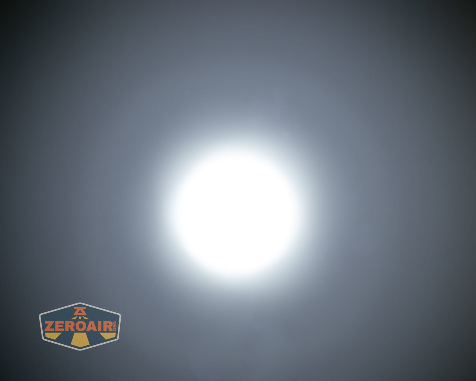 Olight Baton Ultra OAL flashlight beamshots on ceiling