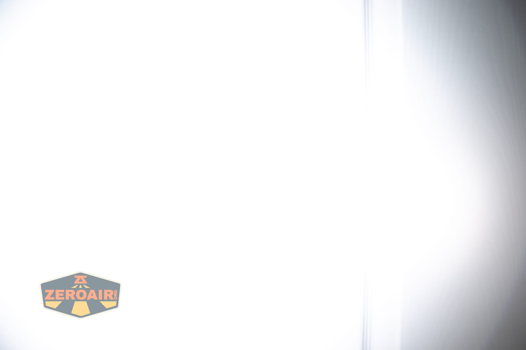 Olight Baton Ultra OAL flashlight beamshots on door (at 1') compared to nichia 219b 4500K