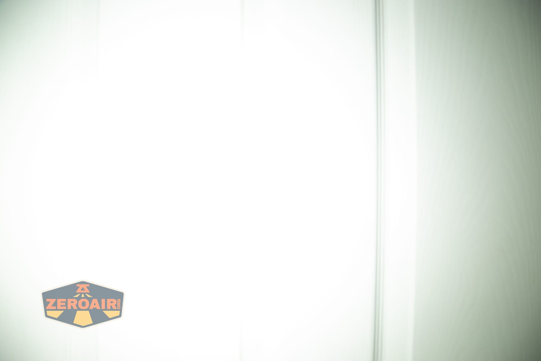 Trustfire Mini C Multifunctional clip-on flashlight beamshots on door (at 1') compared to nichia 219b 4500K