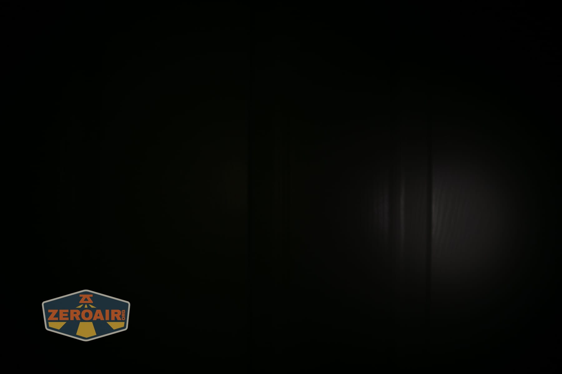 Trustfire Mini C Multifunctional clip-on flashlight beamshots on door (at 1') compared to nichia 219b 4500K