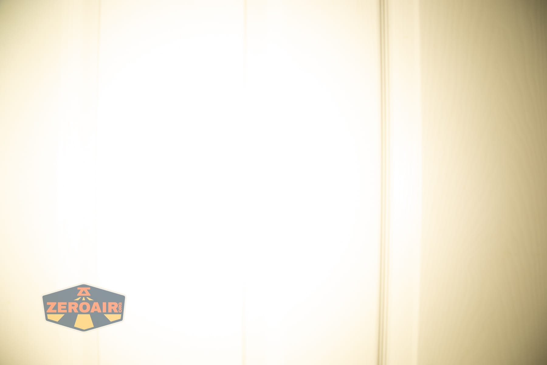 Trustfire Mini C Multifunctional clip-on flashlight beamshots on door (at 1') compared to nichia 219b 4500K