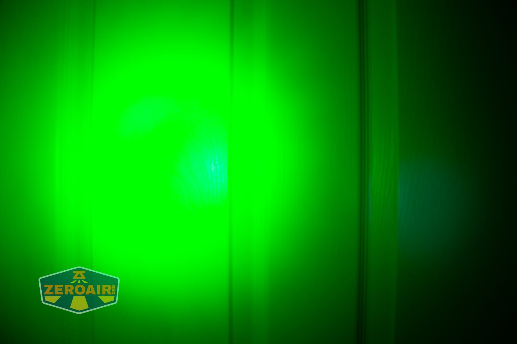 Trustfire Mini C Multifunctional clip-on flashlight beamshots on door (at 1') compared to nichia 219b 4500K