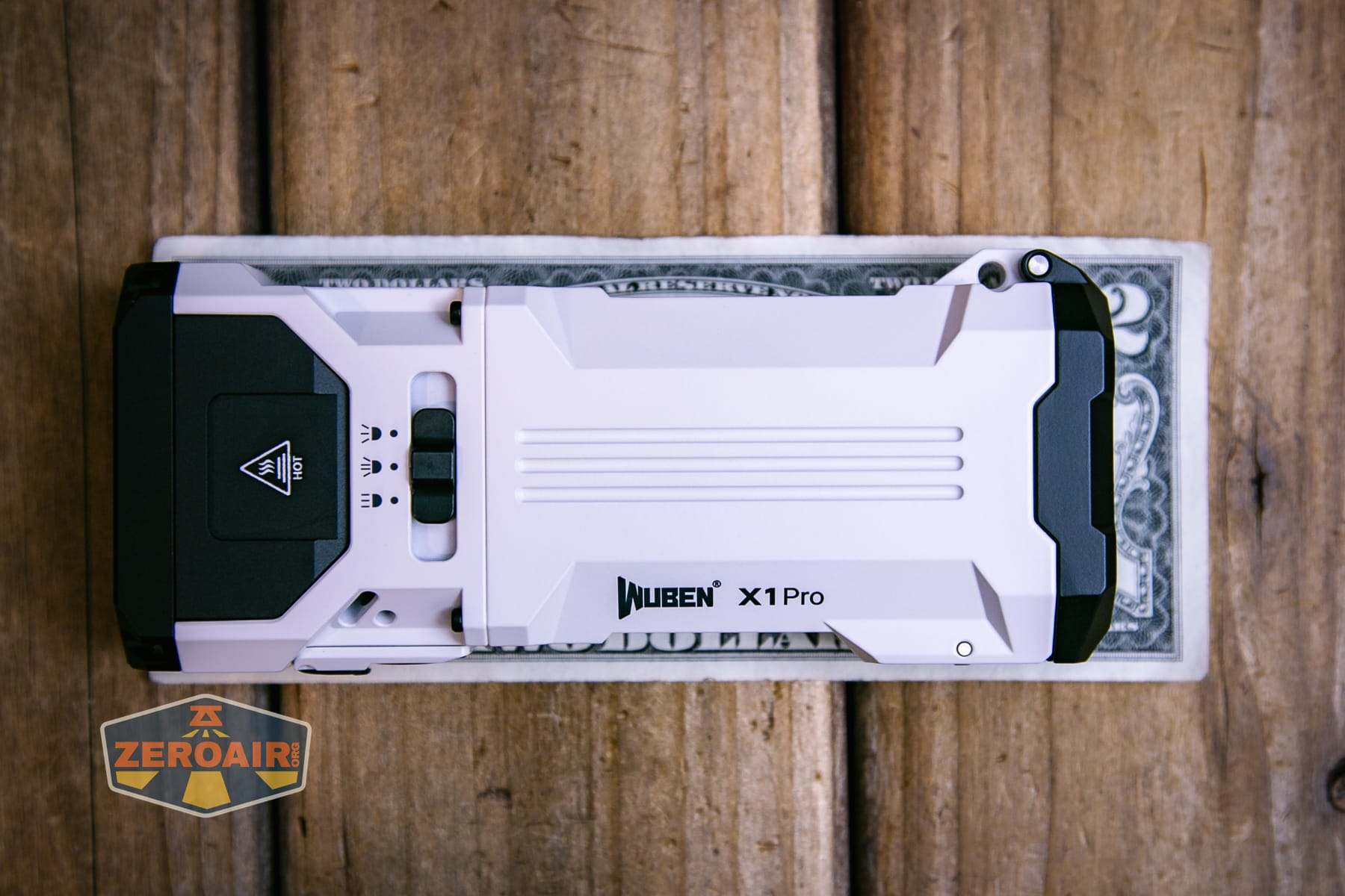 Wuben X1 Pro 2 flashlight on a two dollar bill