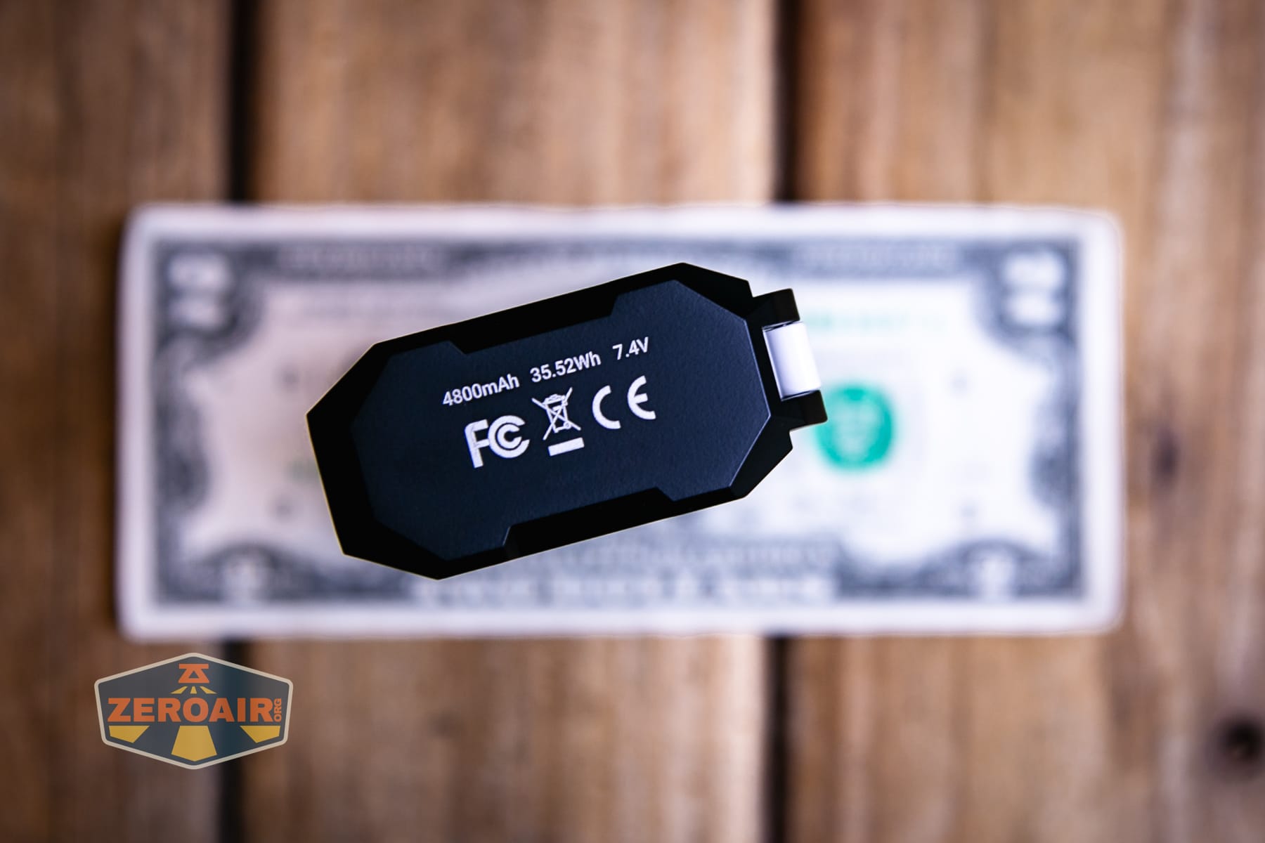 Wuben X1 Pro 2 flashlight on a two dollar bill