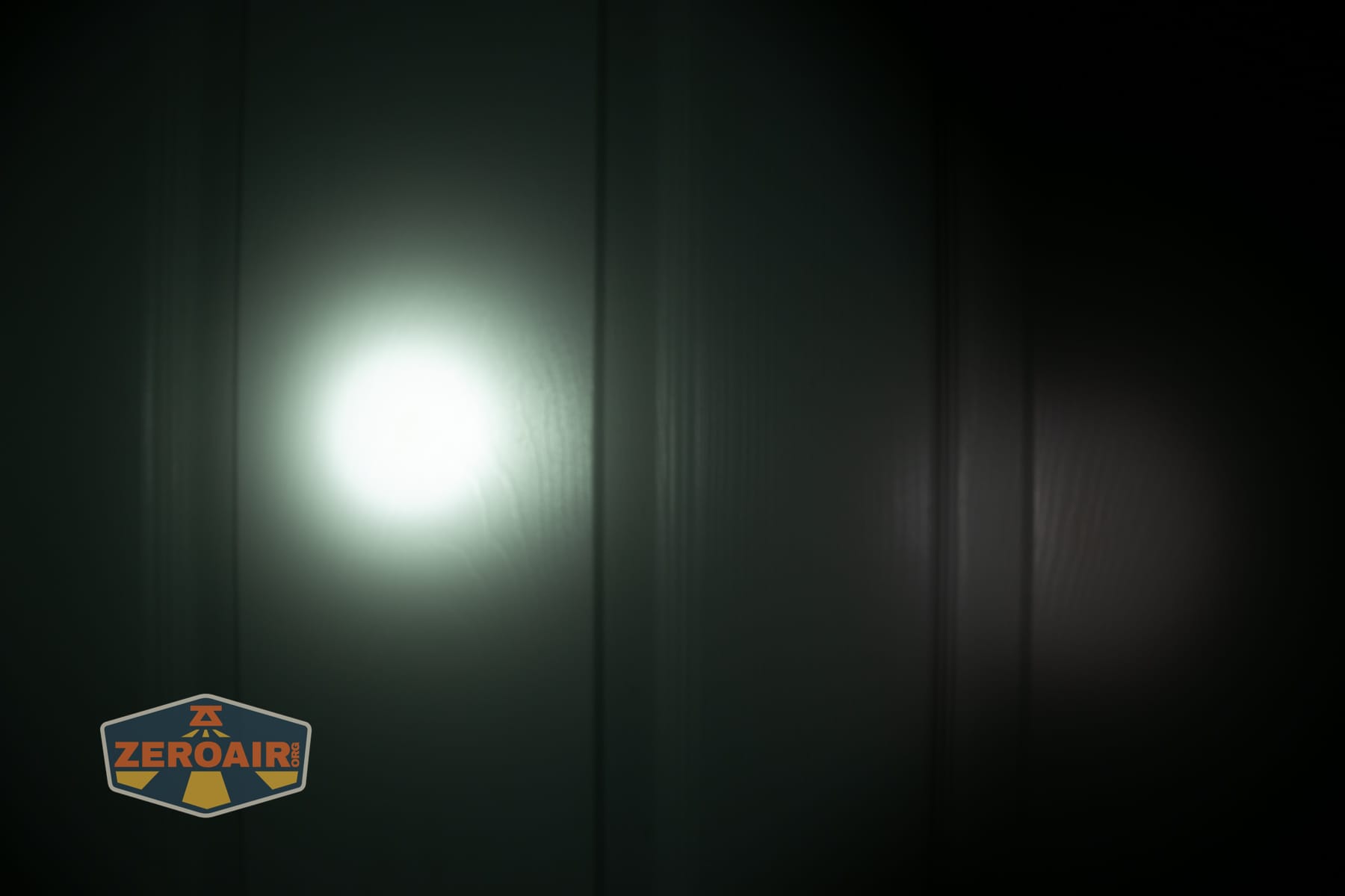 Wuben X1 Pro 2 flashlight beamshots on door (at 1') compared to nichia 219b 4500K