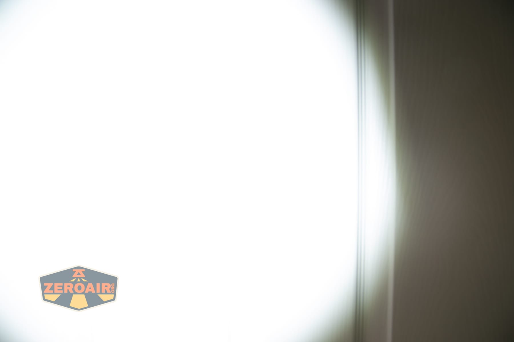 Wuben X1 Pro 2 flashlight beamshots on door (at 1') compared to nichia 219b 4500K