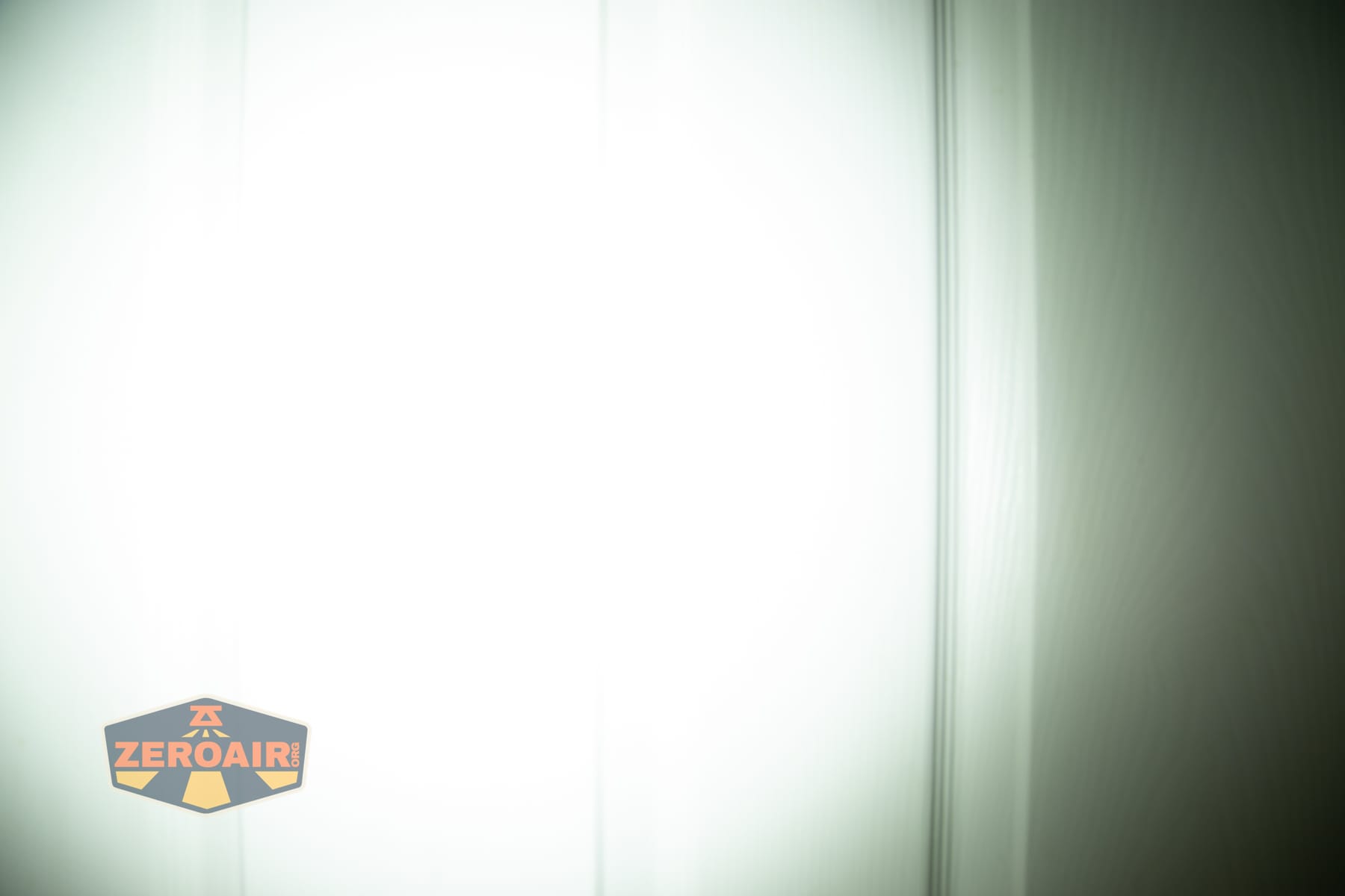 Wuben X1 Pro 2 flashlight beamshots on door (at 1') compared to nichia 219b 4500K
