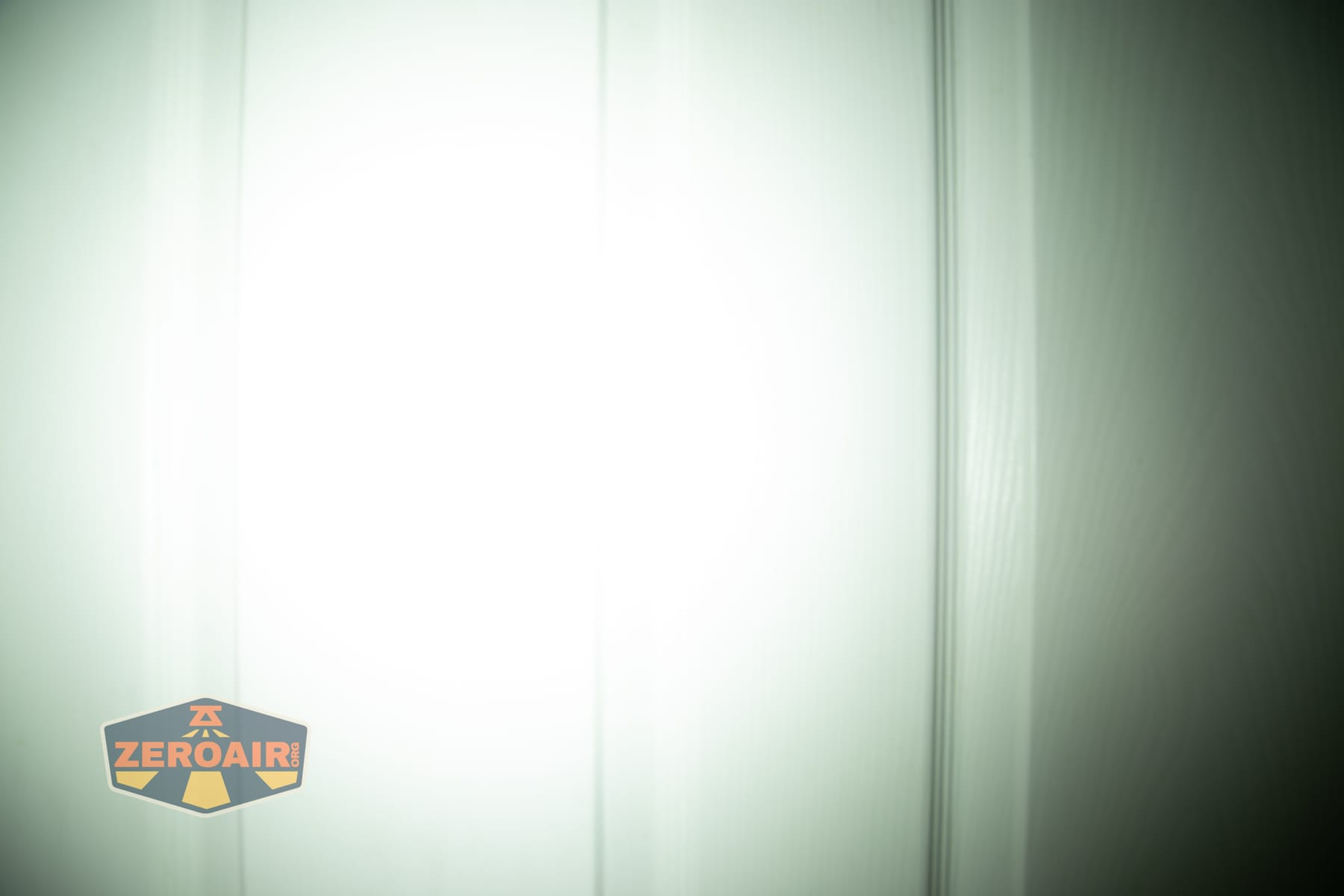 Wuben X1 Pro 2 flashlight beamshots on door (at 1') compared to nichia 219b 4500K